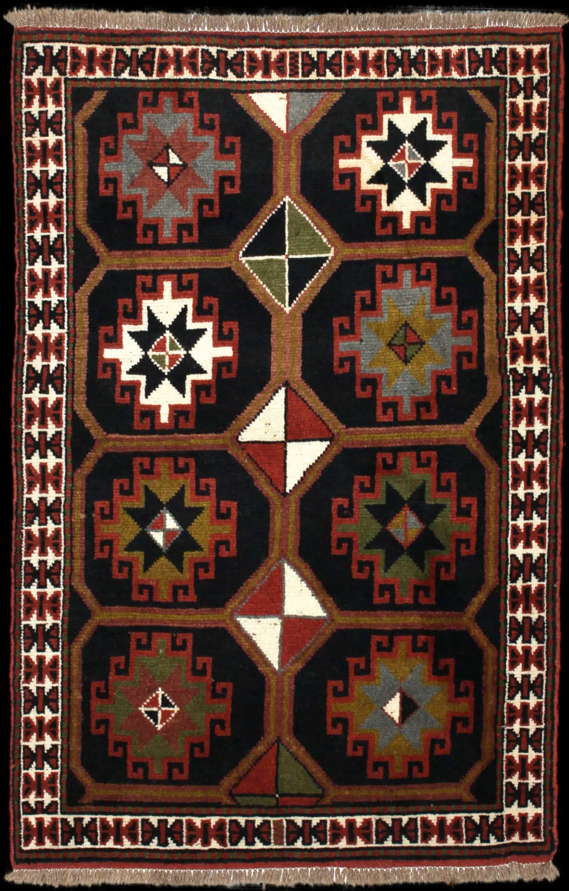 Handmade Perse rug in dimensions 164 centimeters length by 107 centimeters width with mainly Noir et Marron colors