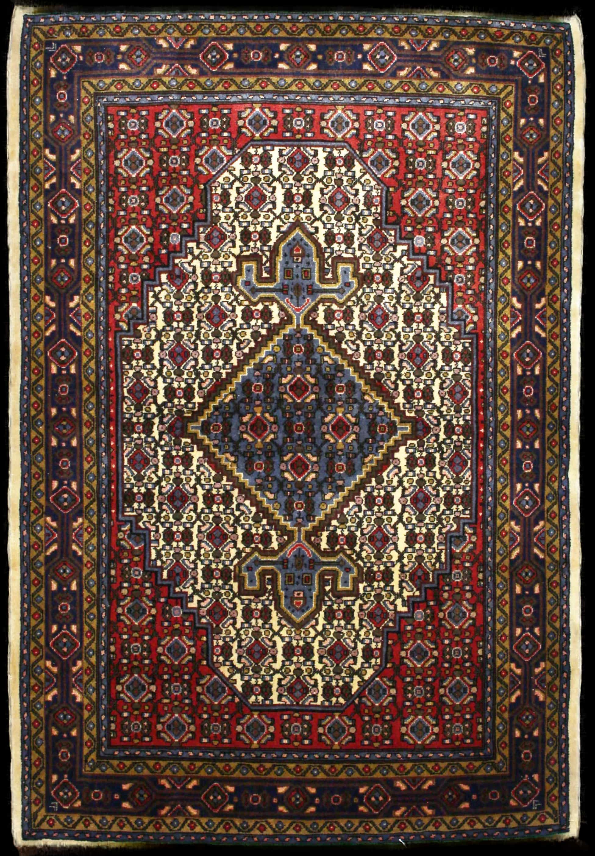 Handmade Perse rug in dimensions 165 centimeters length by 112 centimeters width with mainly Rouge et Bleu colors