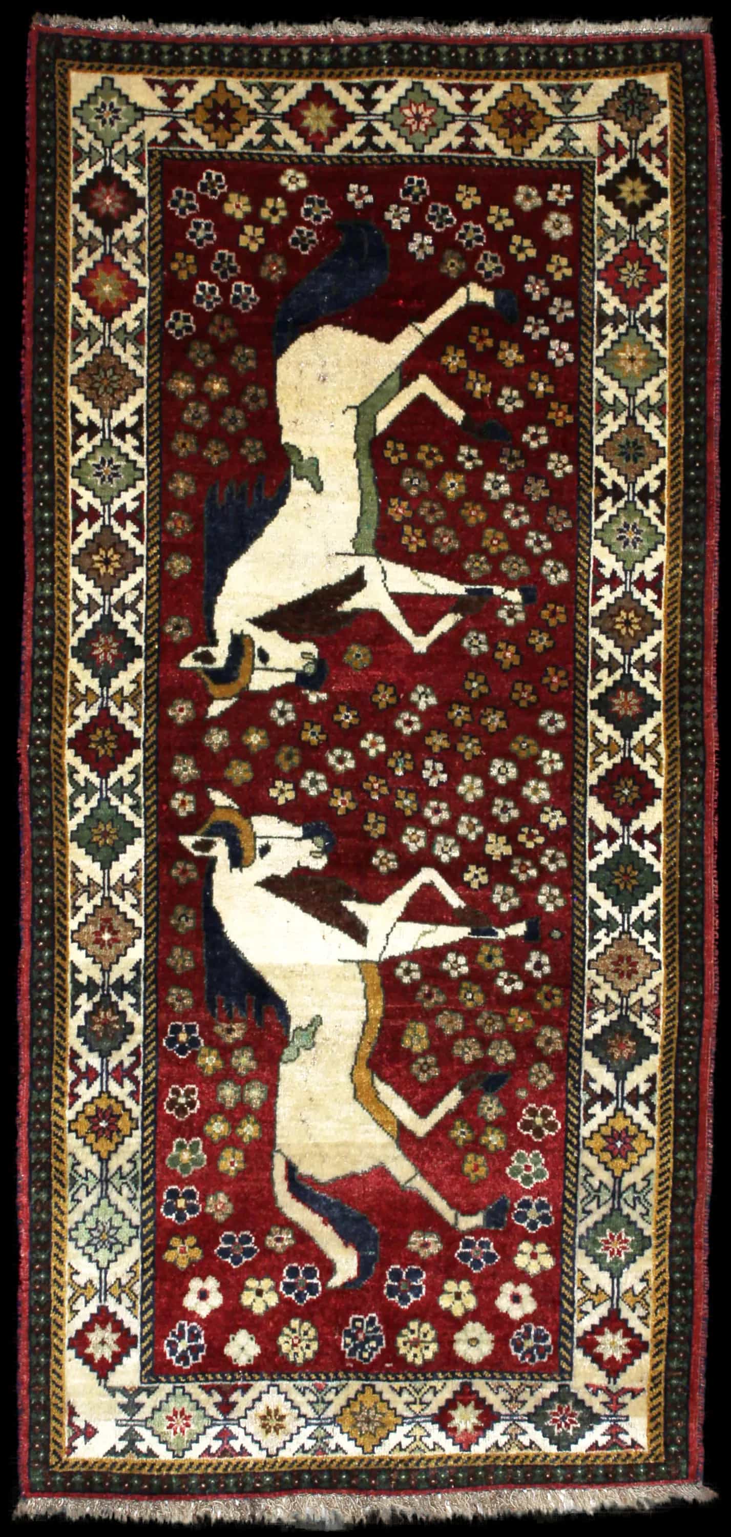 Handmade Perse rug in dimensions 203 centimeters length by 96 centimeters width with mainly Rouge colors