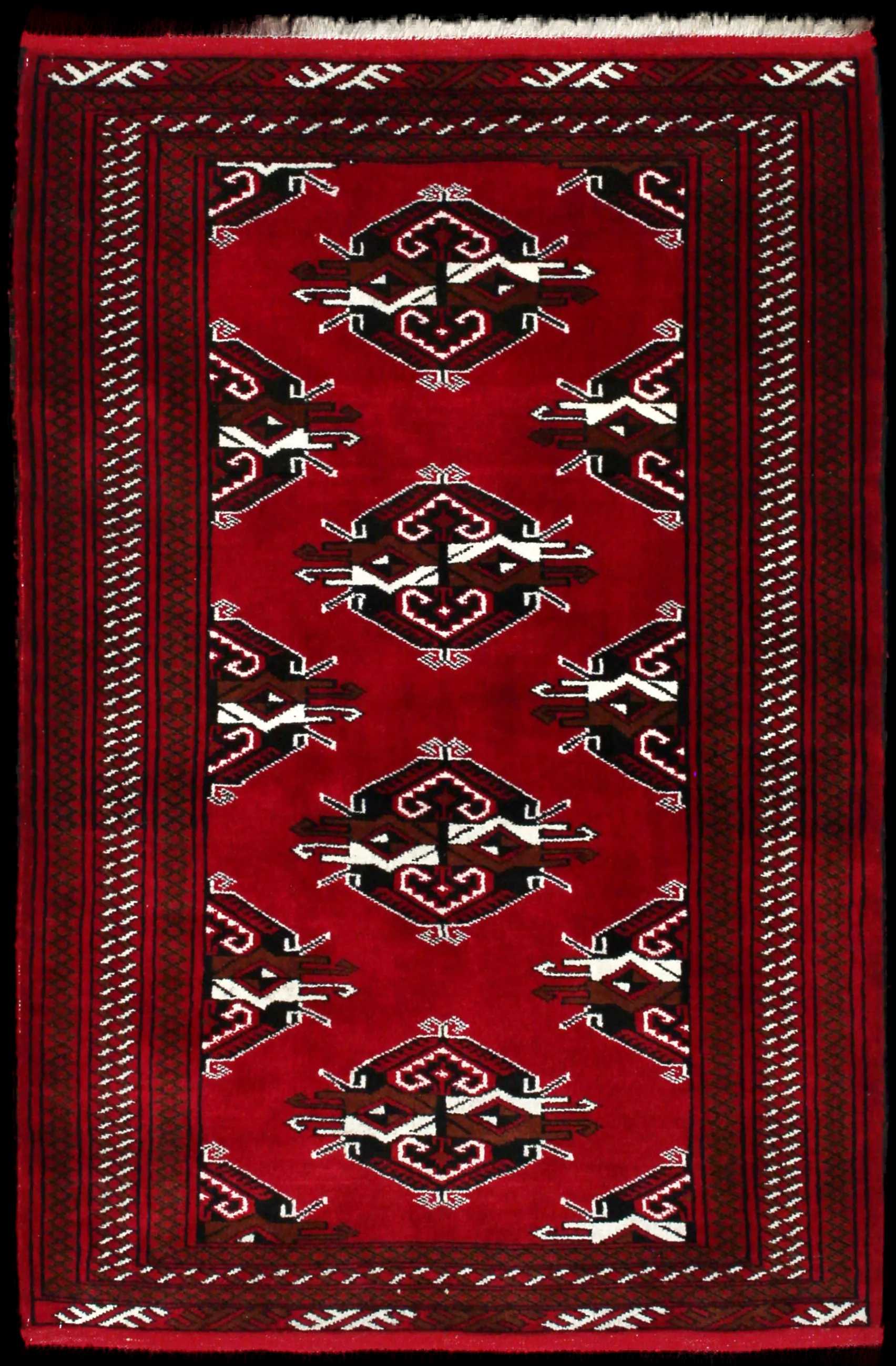 Handmade Persian rug of Turkoman style in dimensions 150 centimeters length by 98 centimetres width with mainly Red colors