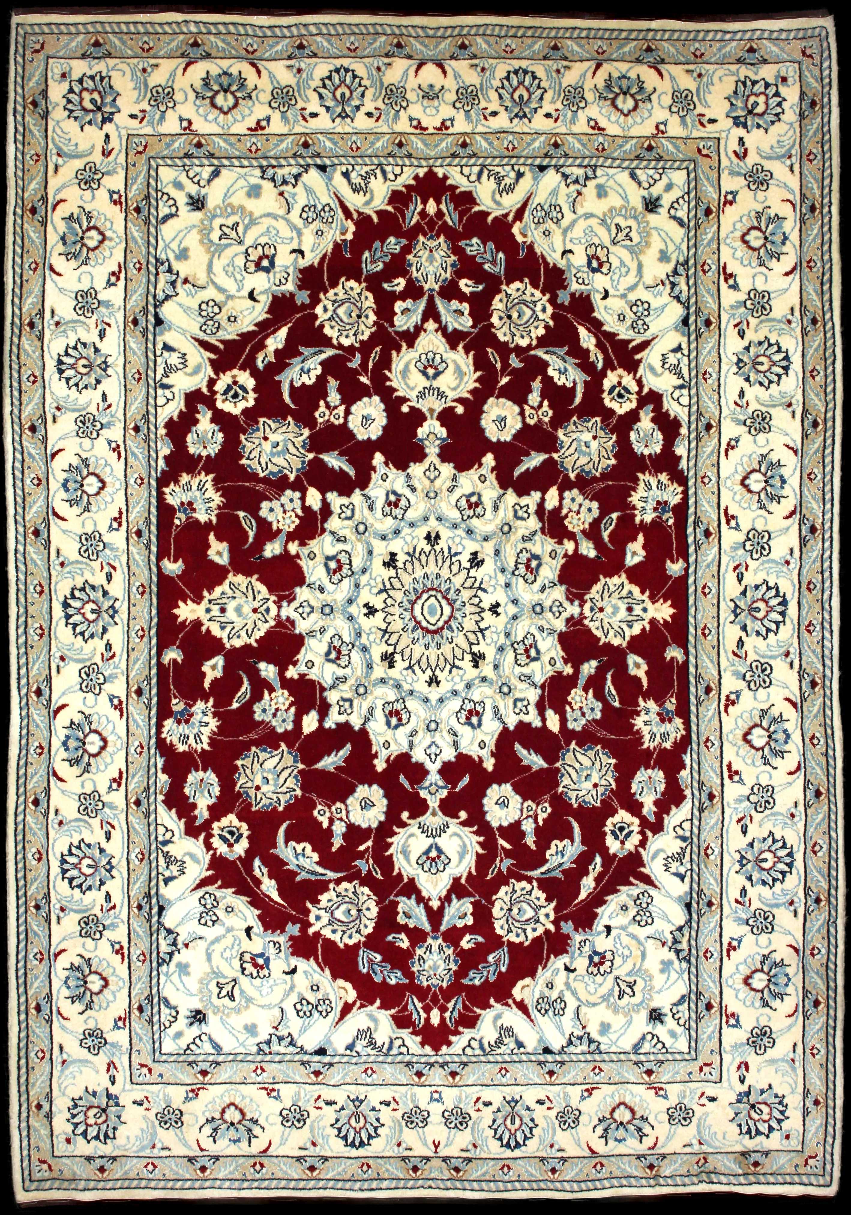 Handmade Persian rug of Nain style in dimensions 240 centimeters length by 170 centimetres width with mainly Beige and Red colors