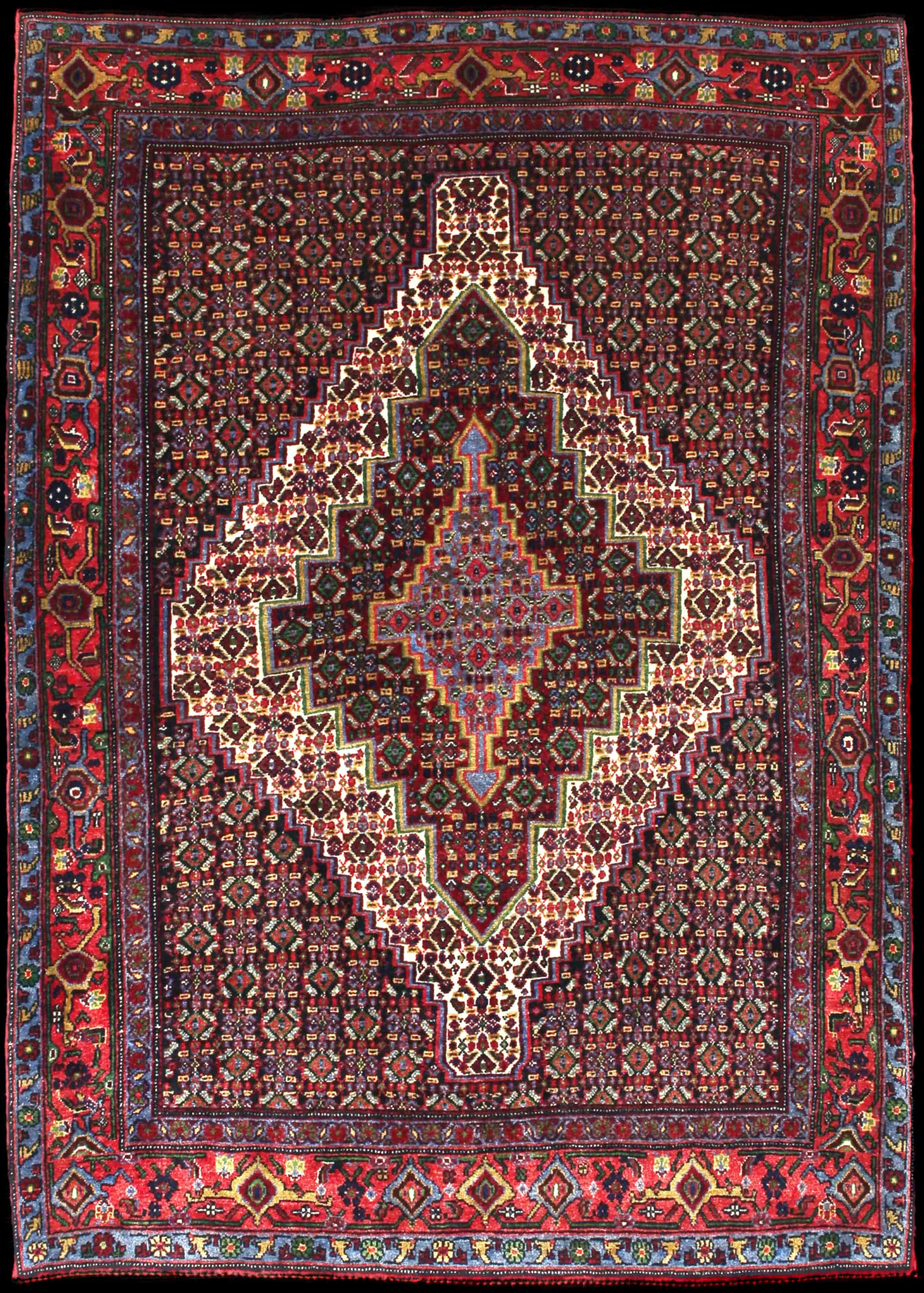 Handmade Perse rug in dimensions 182 centimeters length by 130 centimeters width with mainly Rouge et Bleu colors