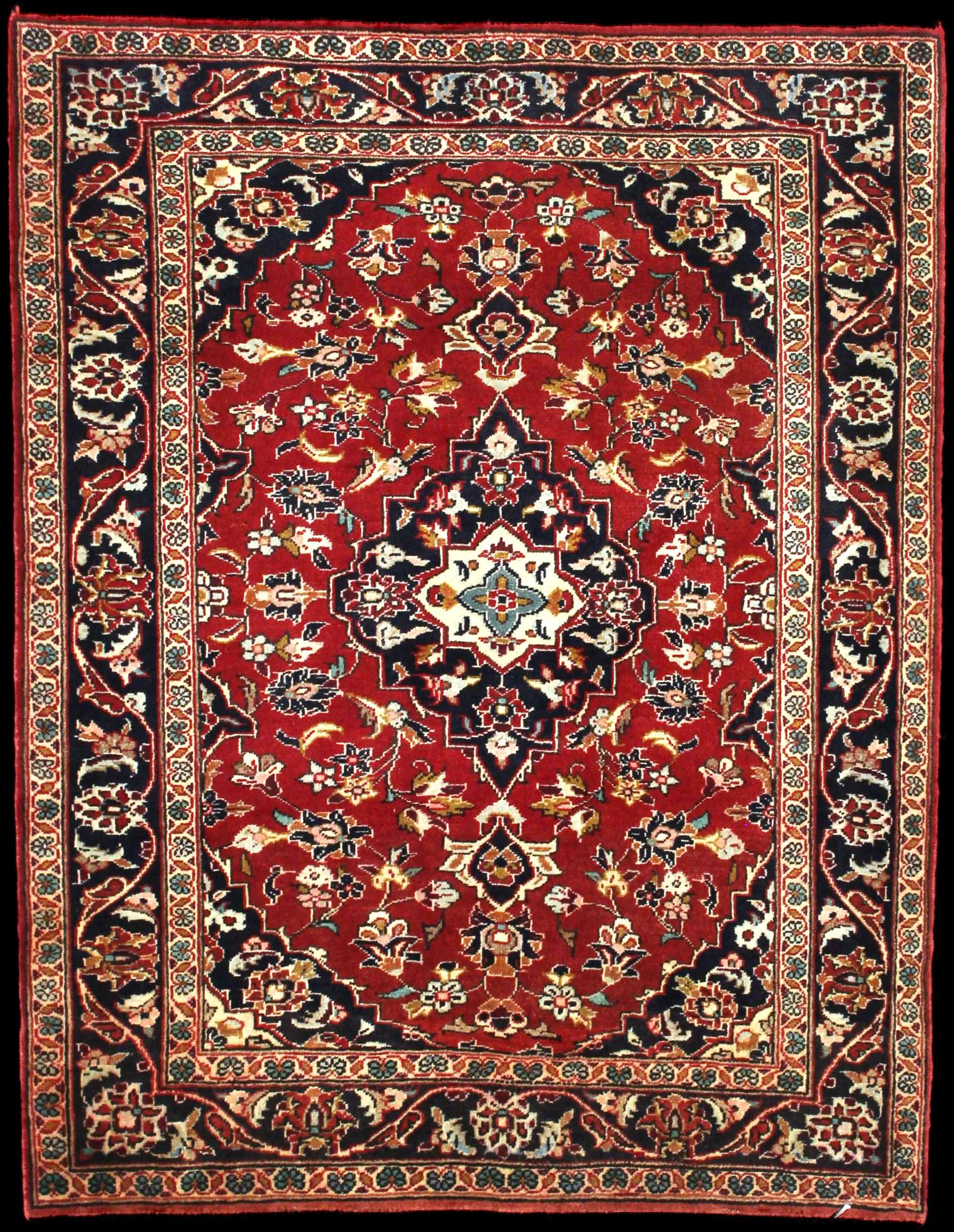 Handmade Persian rug in dimensions 143 centimeters length by 111 centimetres width with mainly Red colors