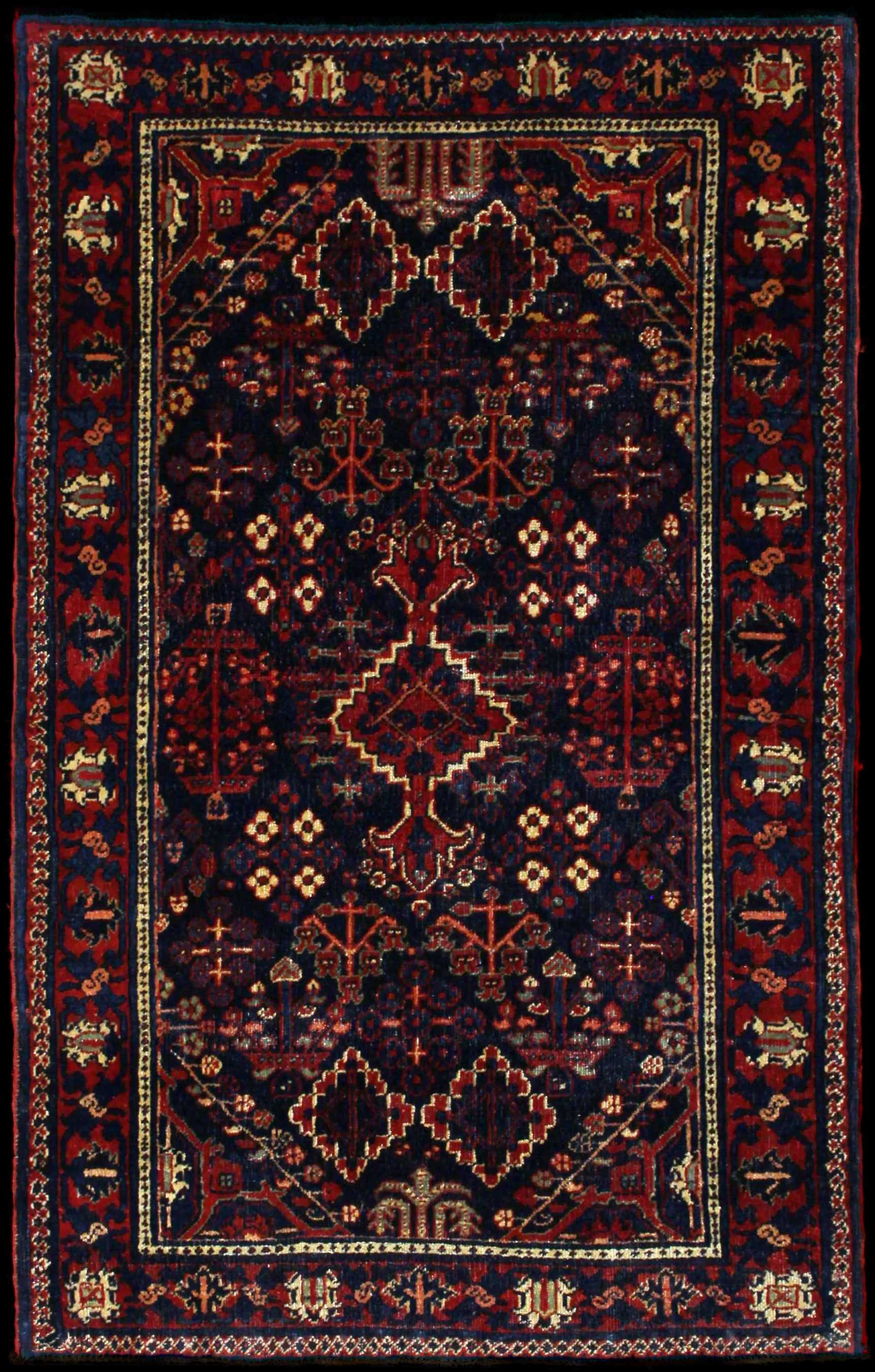 Handmade Perse rug in dimensions 157 centimeters length by 100 centimeters width with mainly Rouge et Bleu colors