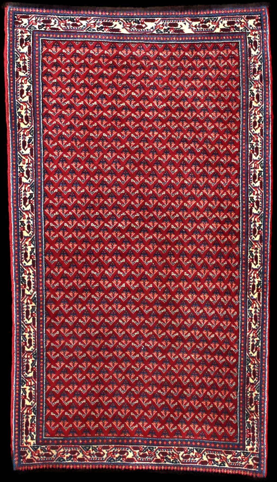 Handmade Persian rug in dimensions 115 centimeters length by 67 centimeters width with mainly Red and Blue colors