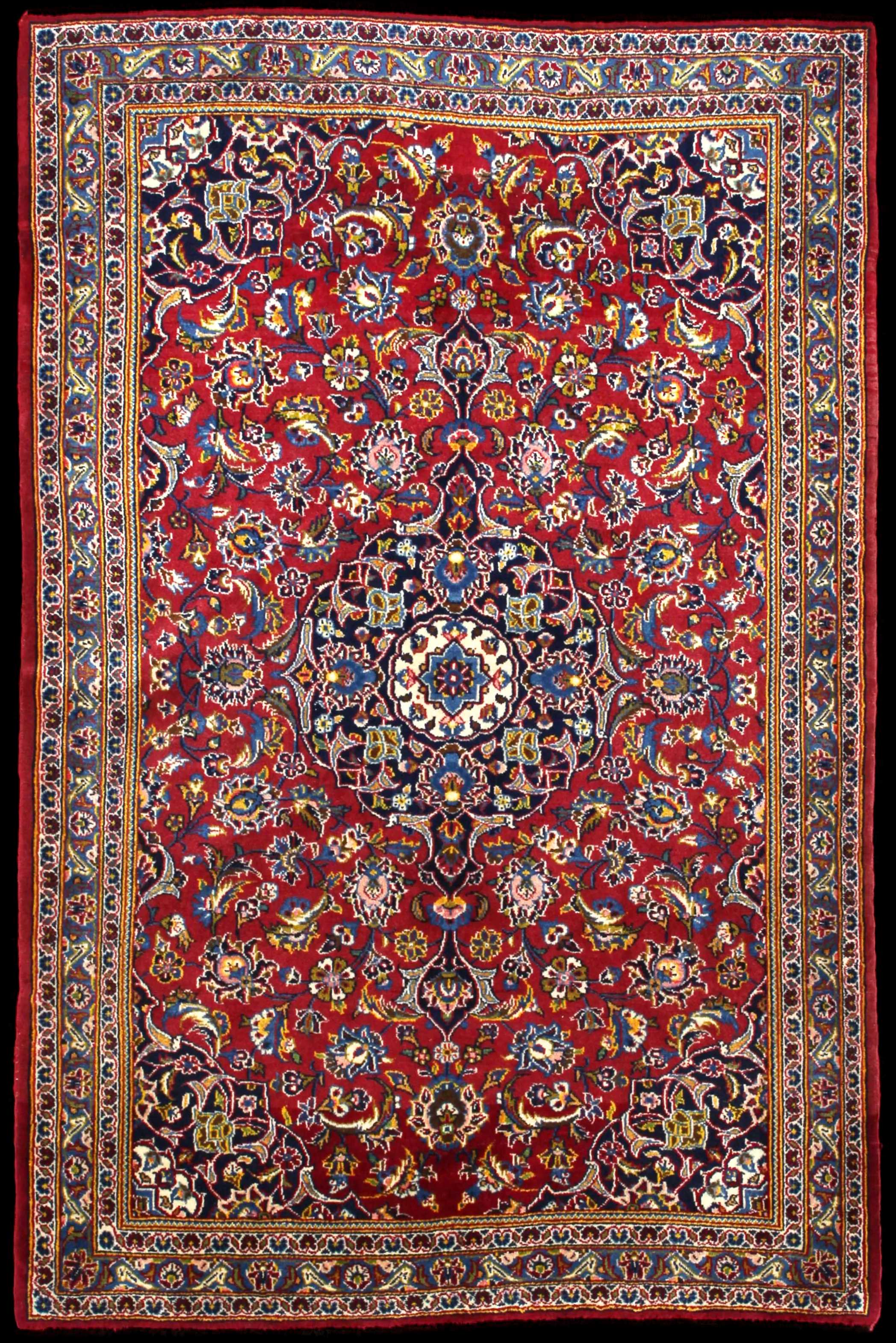 Handmade Persian rug in dimensions 184 centimeters length by 120 centimetres width with mainly Red and Blue colors