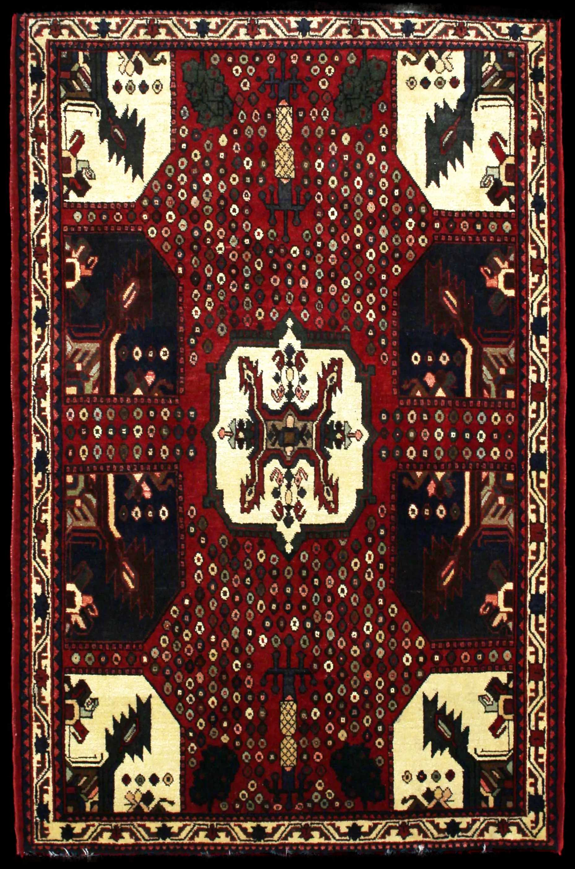 Handmade Perse rug in dimensions 162 centimeters length by 107 centimeters width with mainly Rouge colors