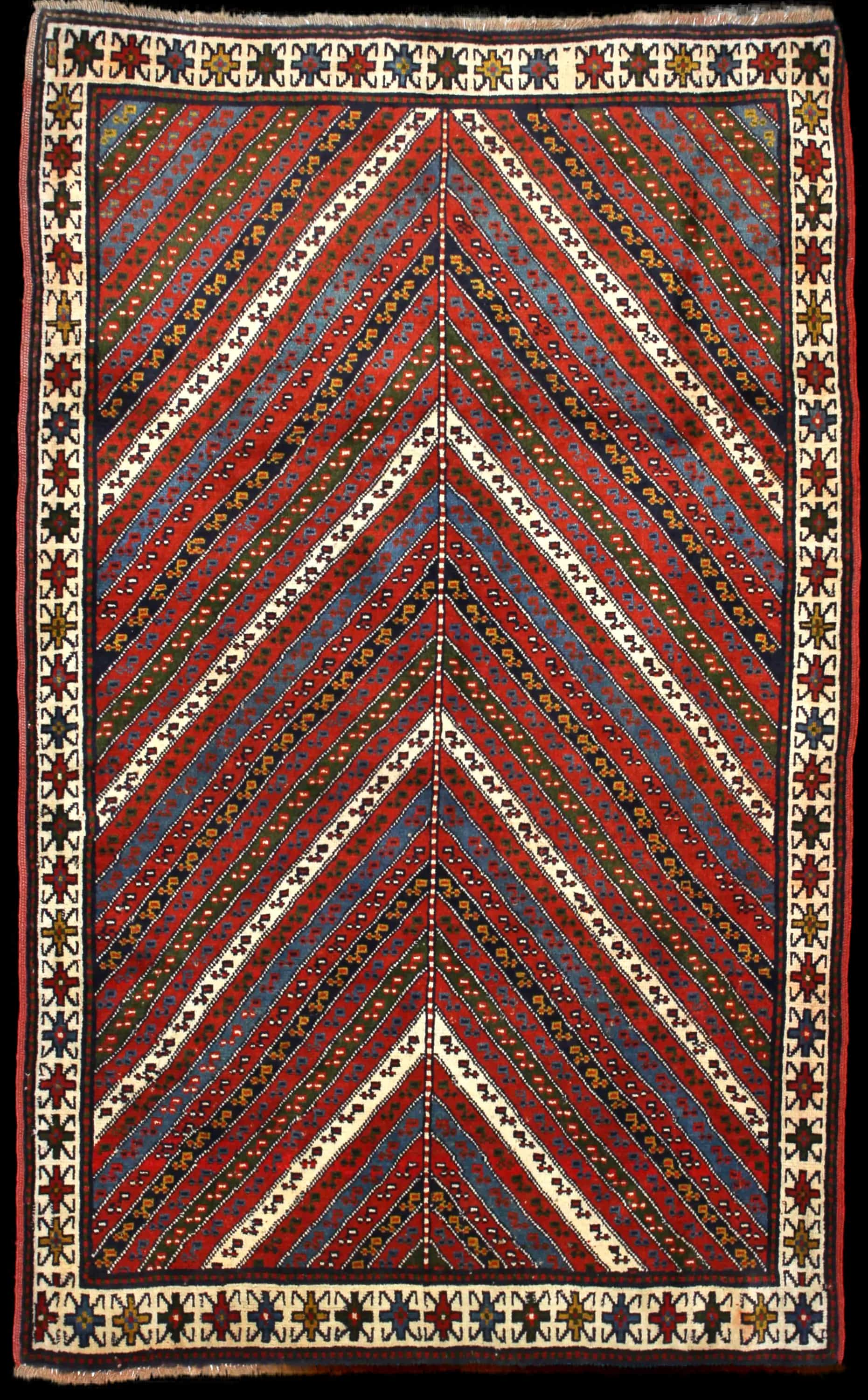 Handmade Perse rug in dimensions 200 centimeters length by 123 centimeters width with mainly Rouge et Vert colors