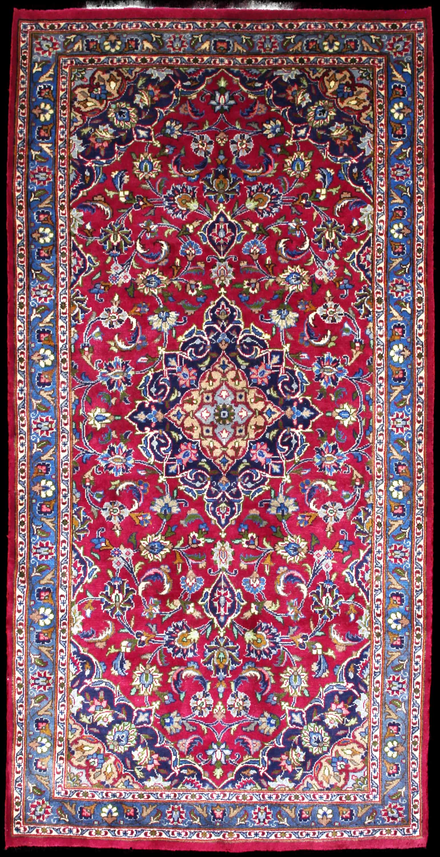 Handmade Persian rug in dimensions 217 centimeters length by 110 centimeters width with mainly Red and Blue colors