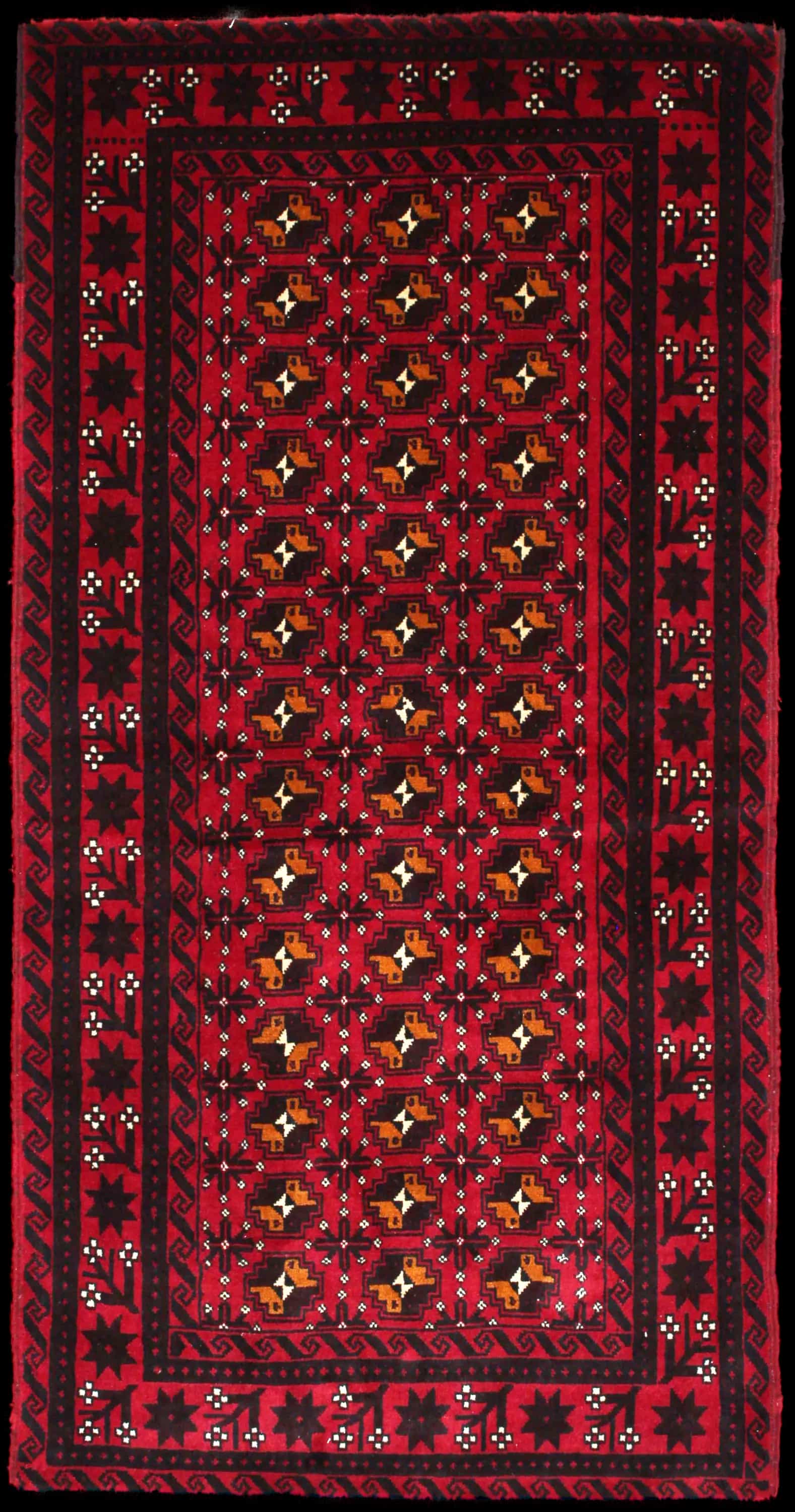 Handmade Persian rug in dimensions 200 centimeters length by 100 centimeters width with mainly Red colors