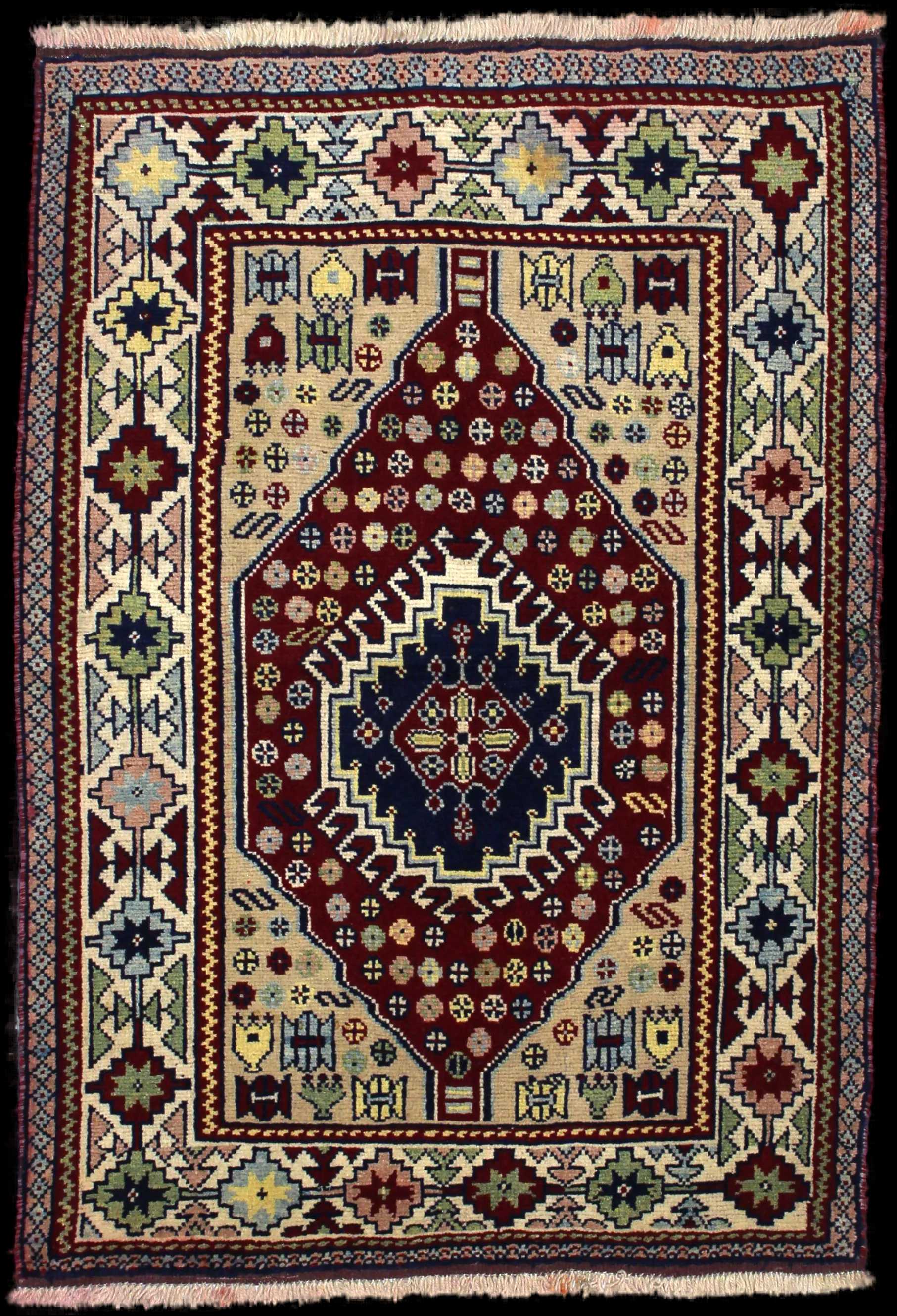 Handmade Perse rug in dimensions 145 centimeters length by 103 centimeters width with mainly Beige et Rouge colors