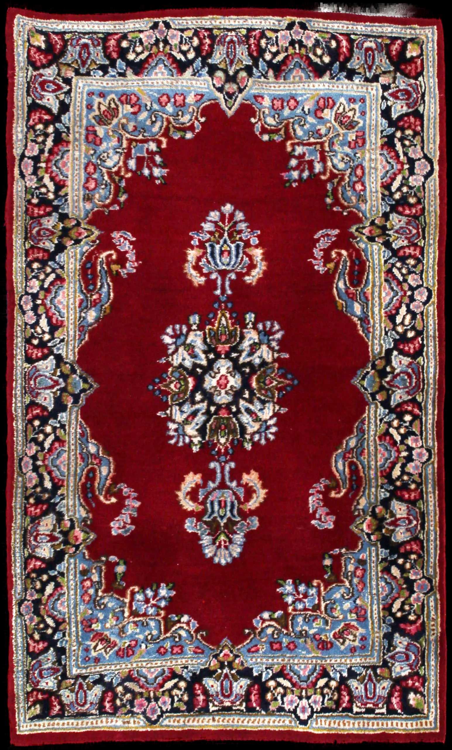 Handmade Perse rug in dimensions 145 centimeters length by 88 centimeters width with mainly Rouge et Bleu colors