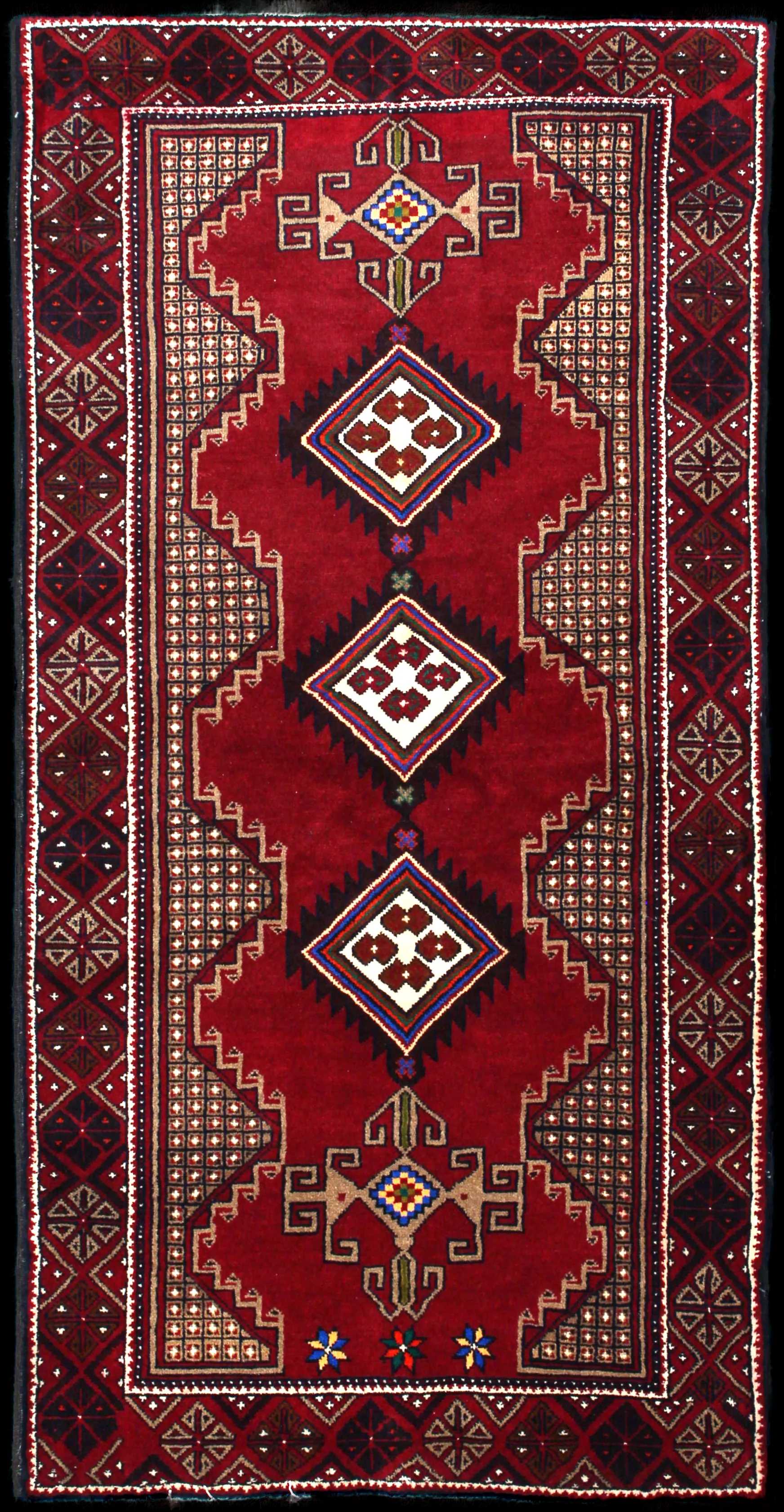 Handmade Persian rug of Baluch style in dimensions 195 centimeters length by 100 centimetres width with mainly Red colors