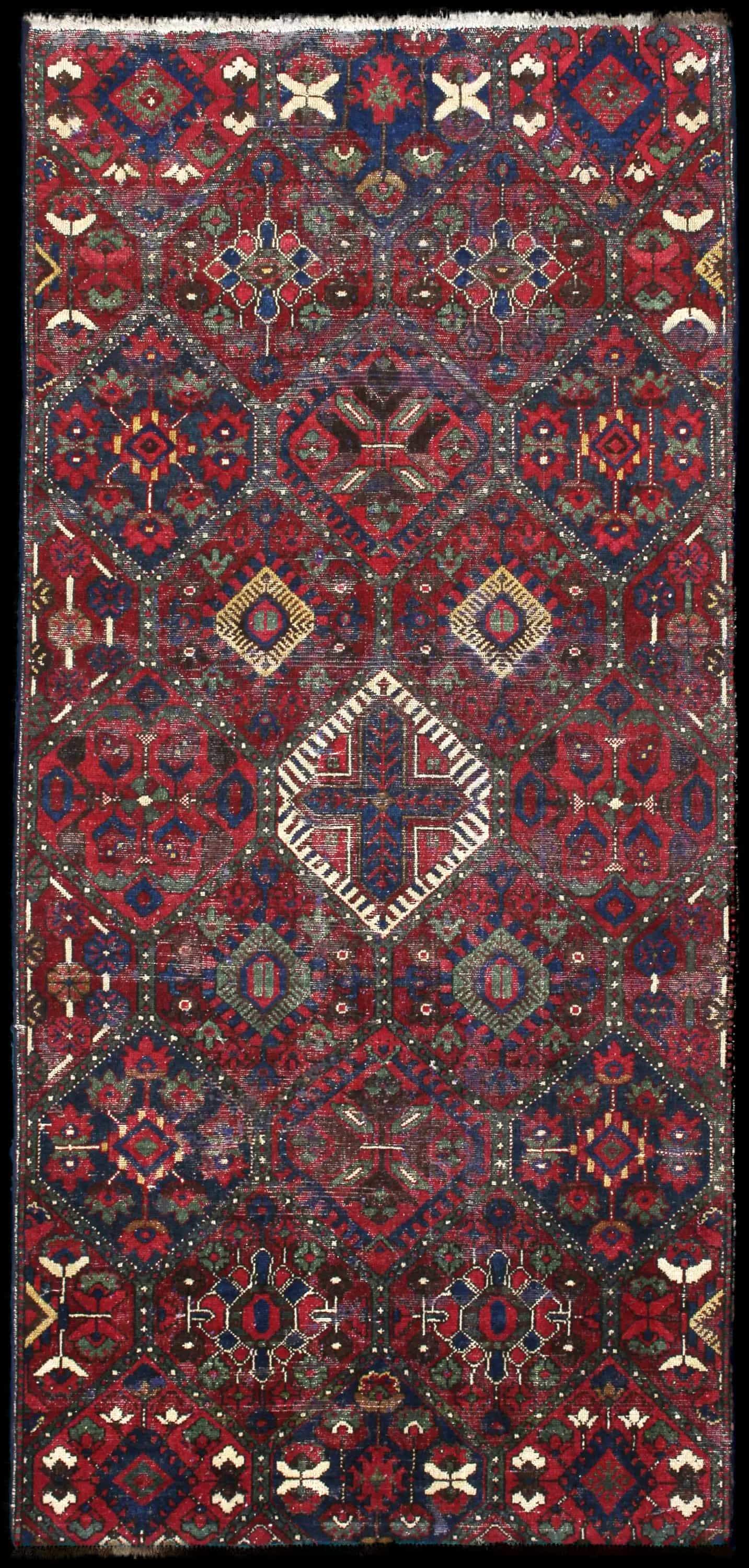 Handmade Perse rug in dimensions 220 centimeters length by 105 centimeters width with mainly Rouge et Bleu colors