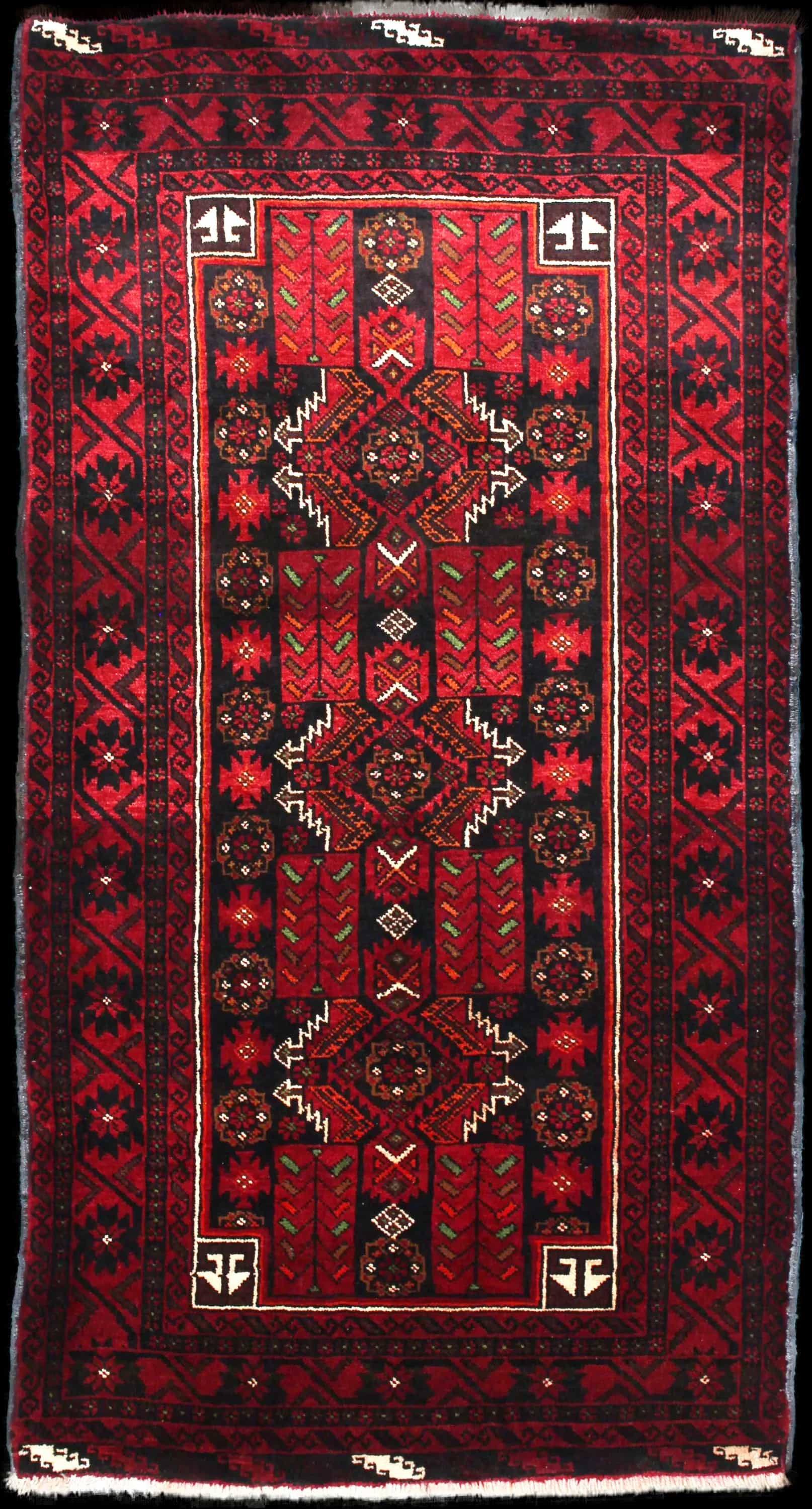 Handmade Perse rug in dimensions 212 centimeters length by 110 centimeters width with mainly Rouge et Noir colors