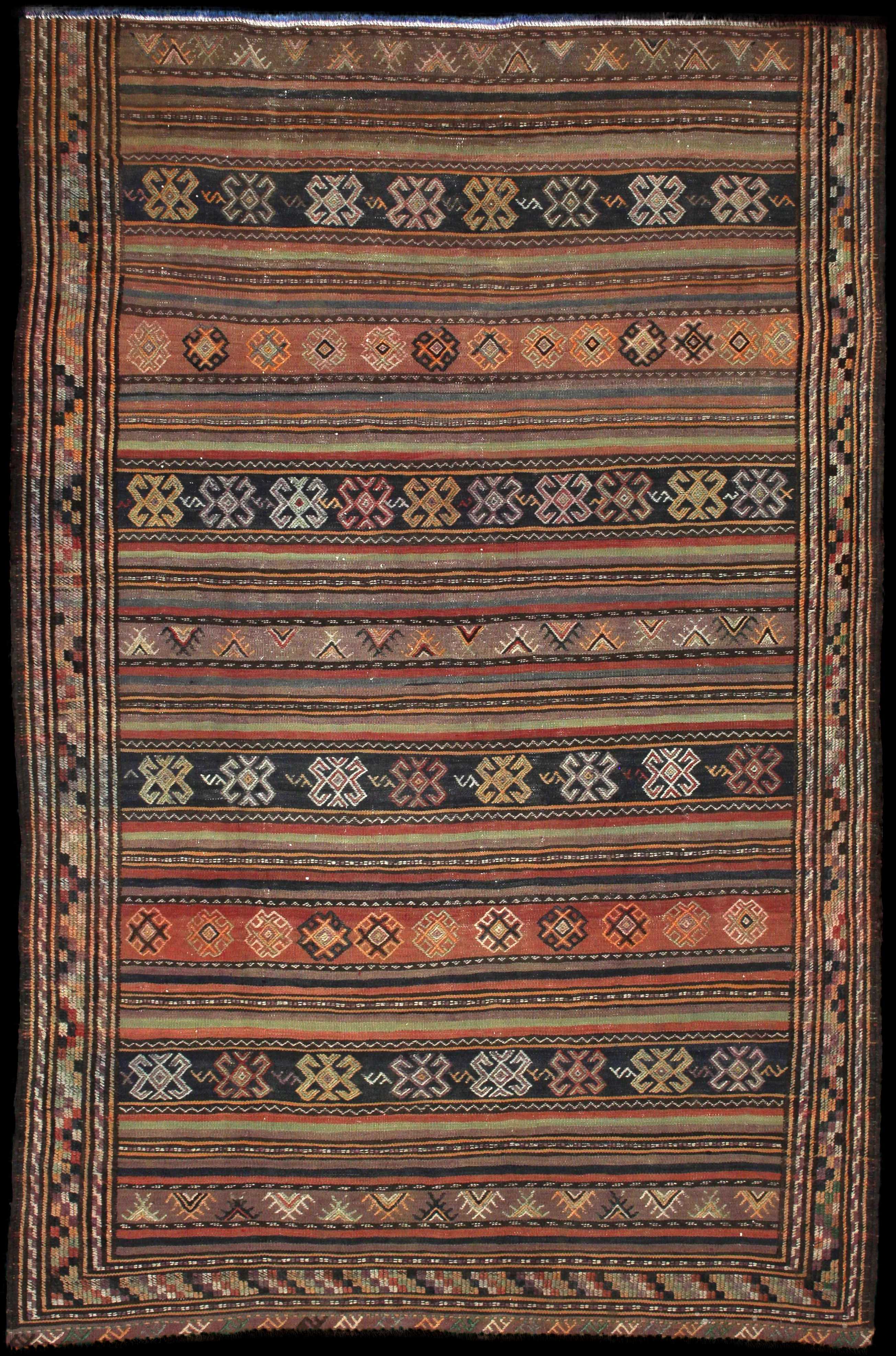 Handmade Persian rug of Sumak style in dimensions 228 centimeters length by 151 centimetres width with mainly Brown colors