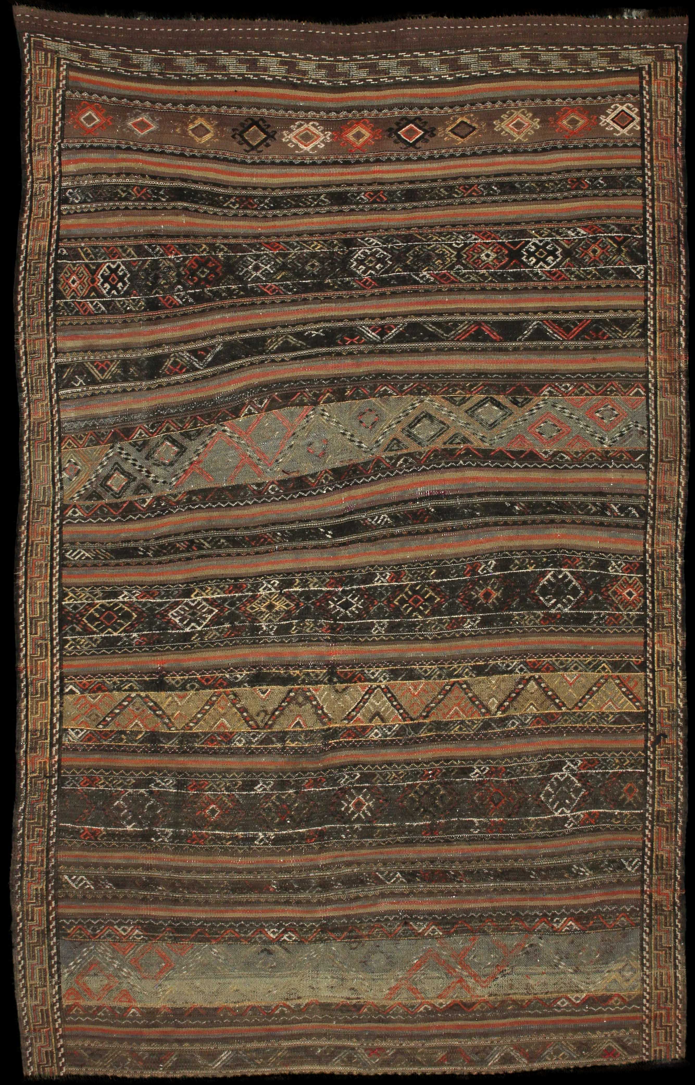 Handmade Persian rug of Sumak style in dimensions 240 centimeters length by 155 centimetres width with mainly Brown colors