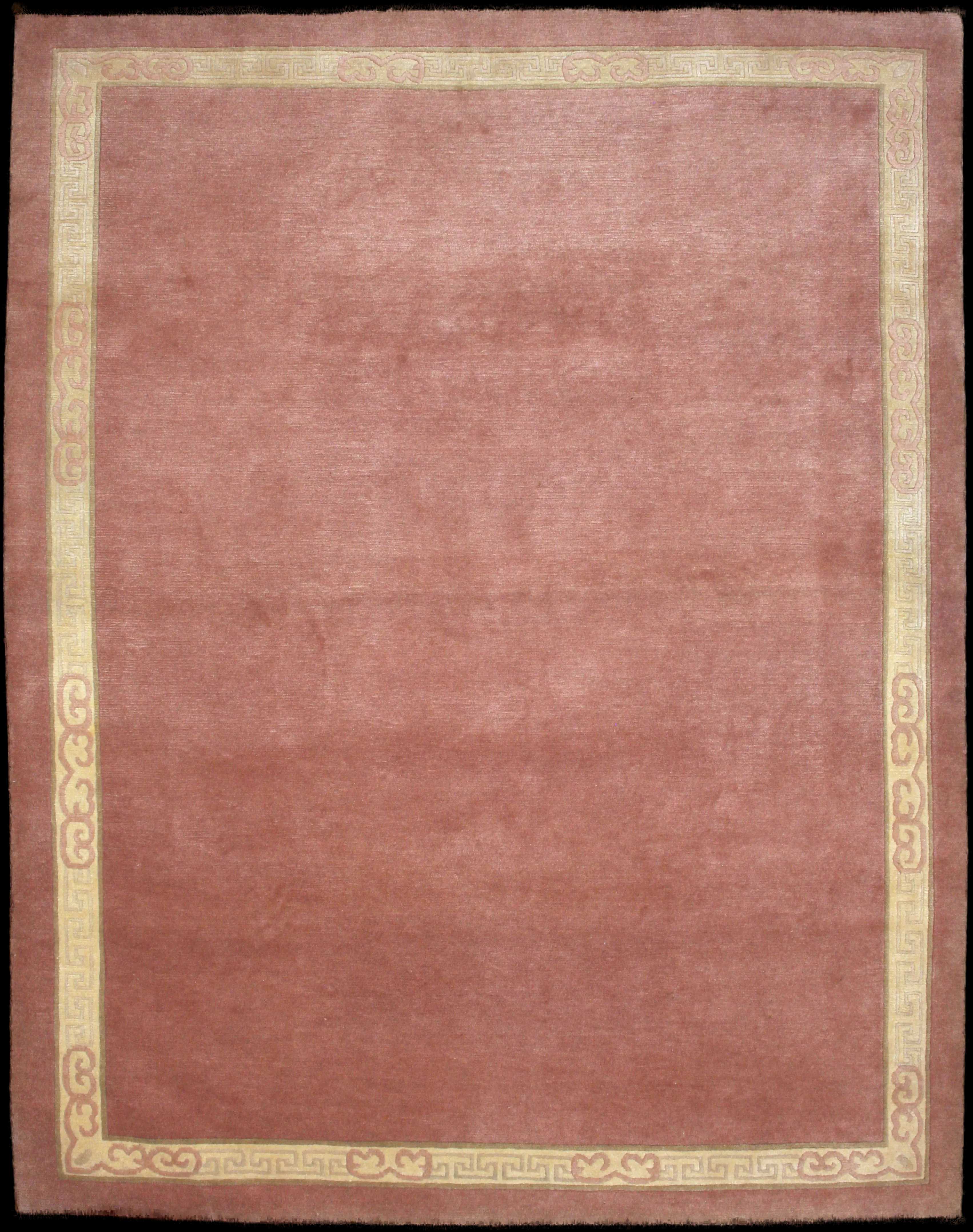 Handmade Nepali rug of Tibetan style in dimensions 255 centimeters length by 202 centimetres width with mainly Pink colors