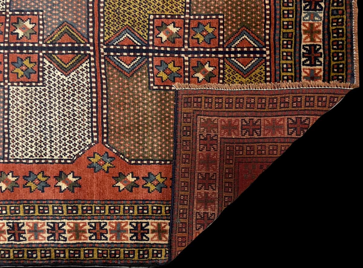 Persian rug of Quchan style in dimensions 185 centimeters length by 115 centimeters width with mainly orange colors — Folded