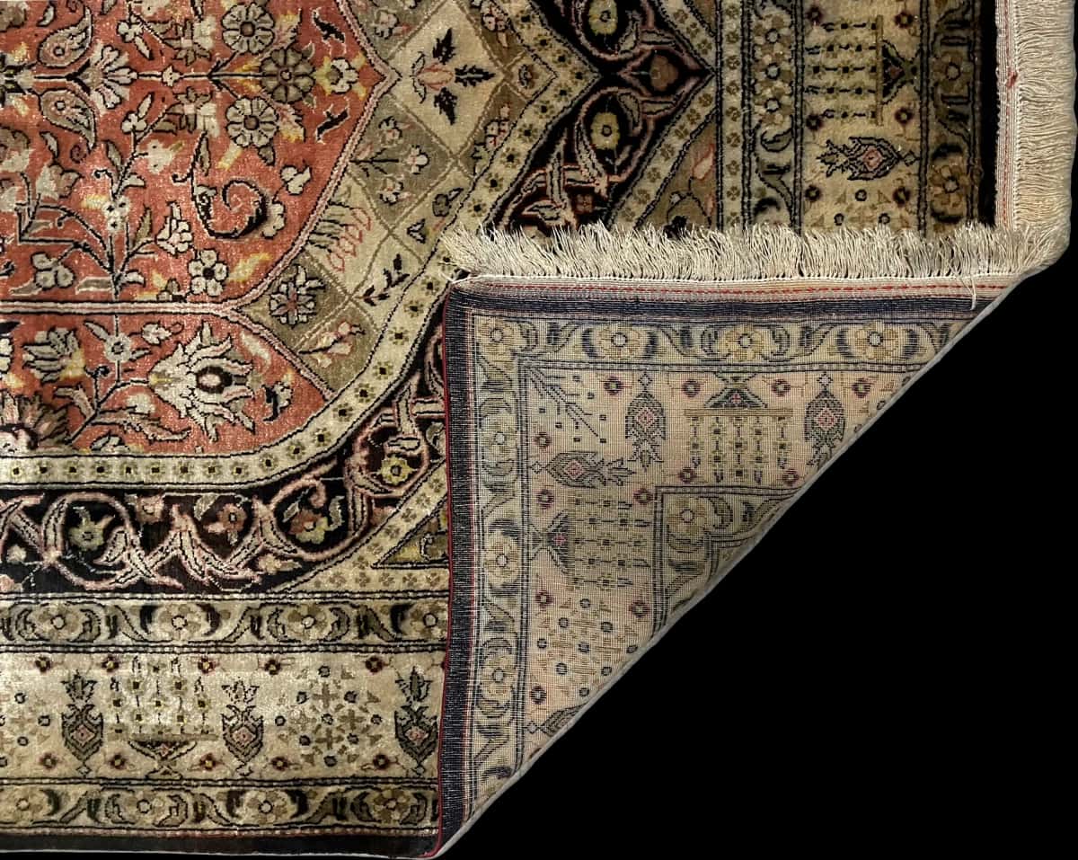 Persian rug of Arak style in dimensions 155 centimeters length by 108 centimeters width with mainly black and orange colors — Folded