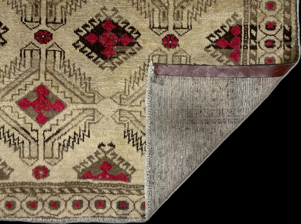 Persian rug of Baluch style in dimensions 214 centimeters length by 125 centimeters width with mainly yellow and brown colors — Folded