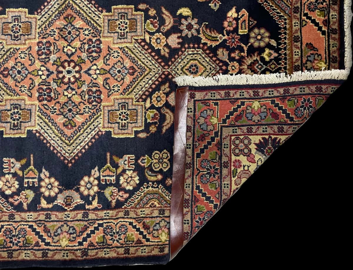 Persian rug of Hamadan style in dimensions 150 centimeters length by 106 centimeters width with mainly blue colors — Folded