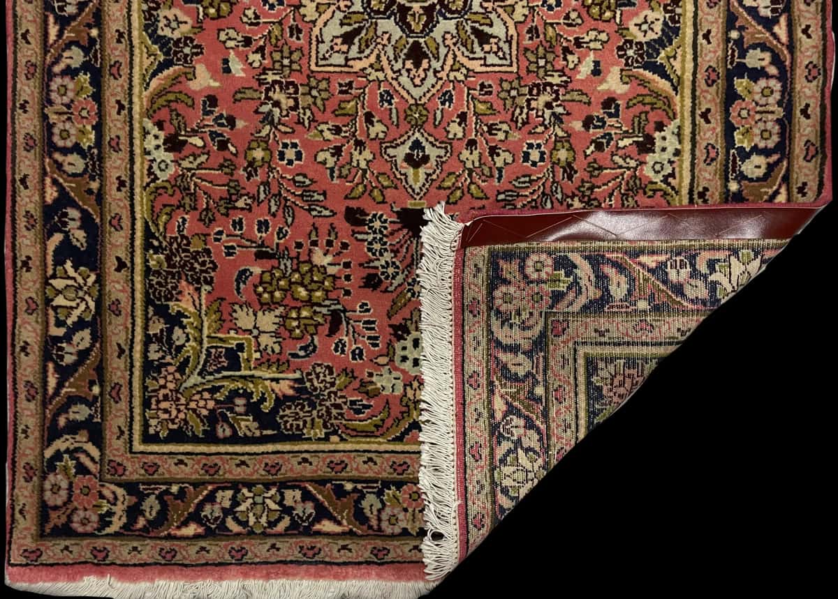 Persian rug of Hamadan style in dimensions 150 centimeters length by 100 centimeters width with mainly pink colors — Folded