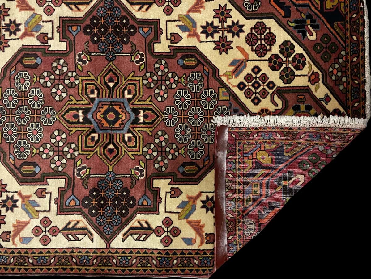 Persian rug of Hamadan style in dimensions 157 centimeters length by 100 centimeters width with mainly brown colors — Folded