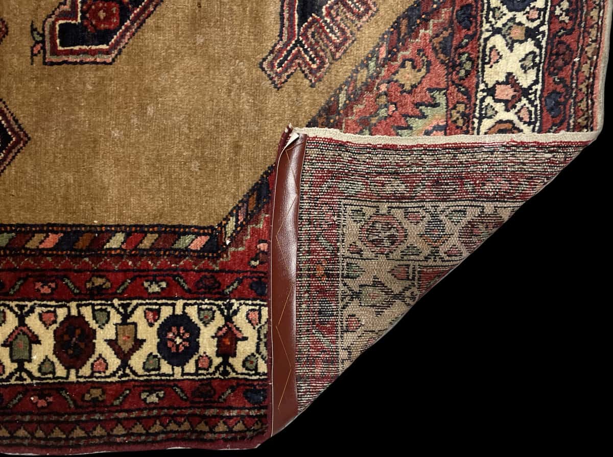 Persian rug of Hamadan style in dimensions 224 centimeters length by 135 centimeters width with mainly yellow and brown colors — Folded
