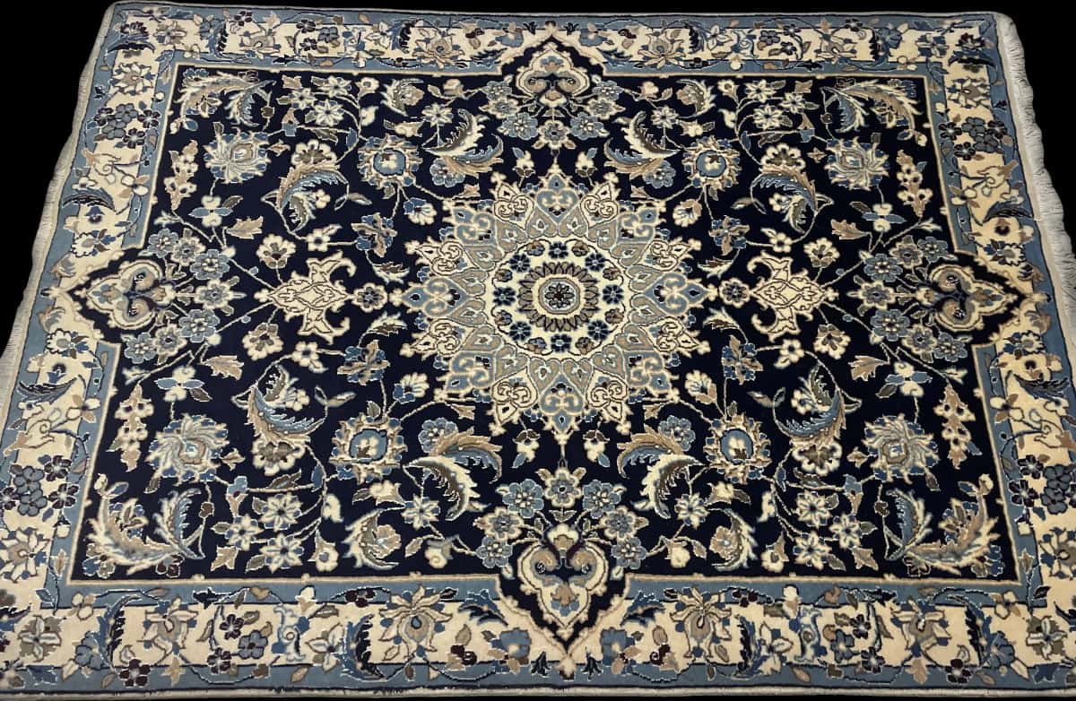 Persian rug of Nain style in dimensions 198 centimeters length by 142 centimeters width with mainly blue colors — Perspective