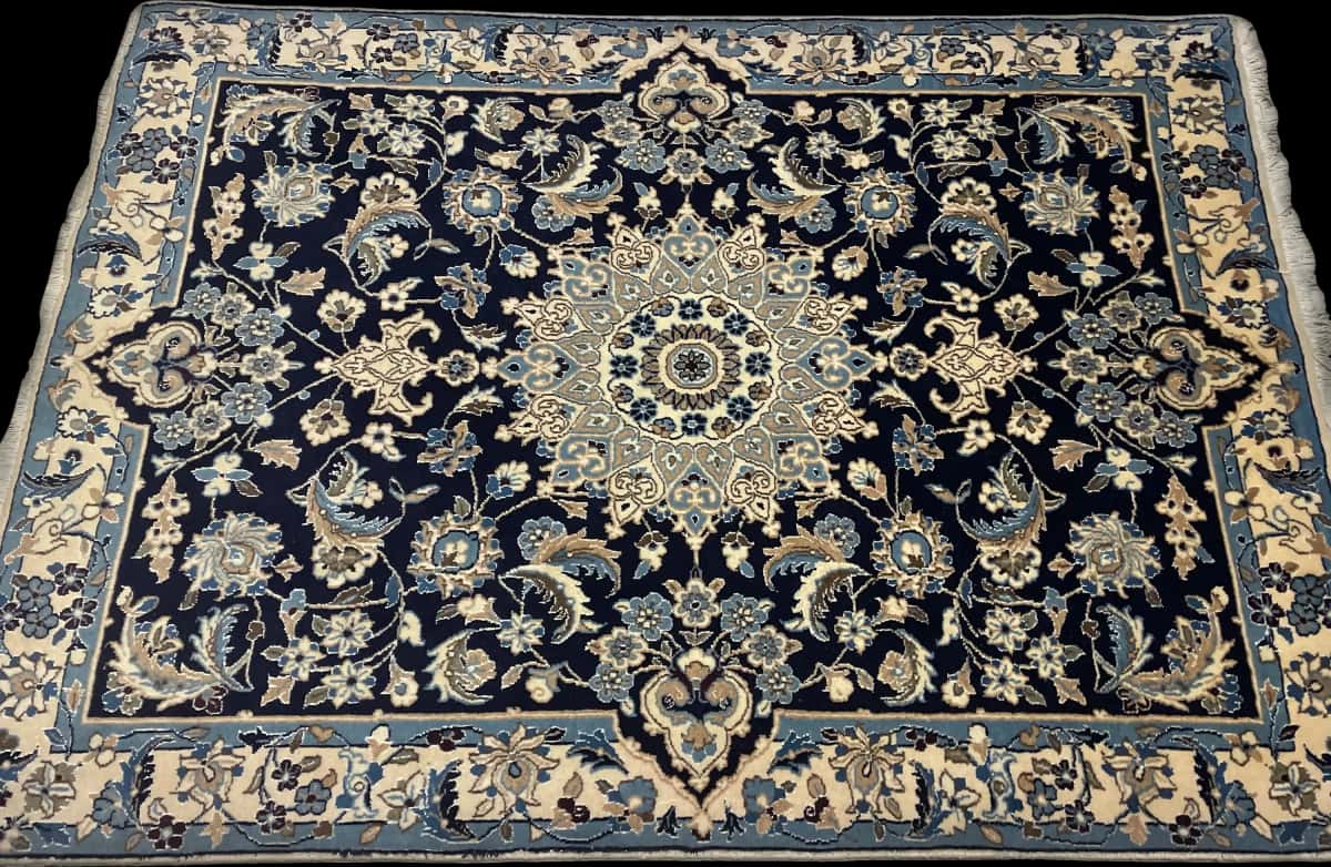 Persian rug of Nain style in dimensions 198 centimeters length by 142 centimeters width with mainly blue colors — Perspective
