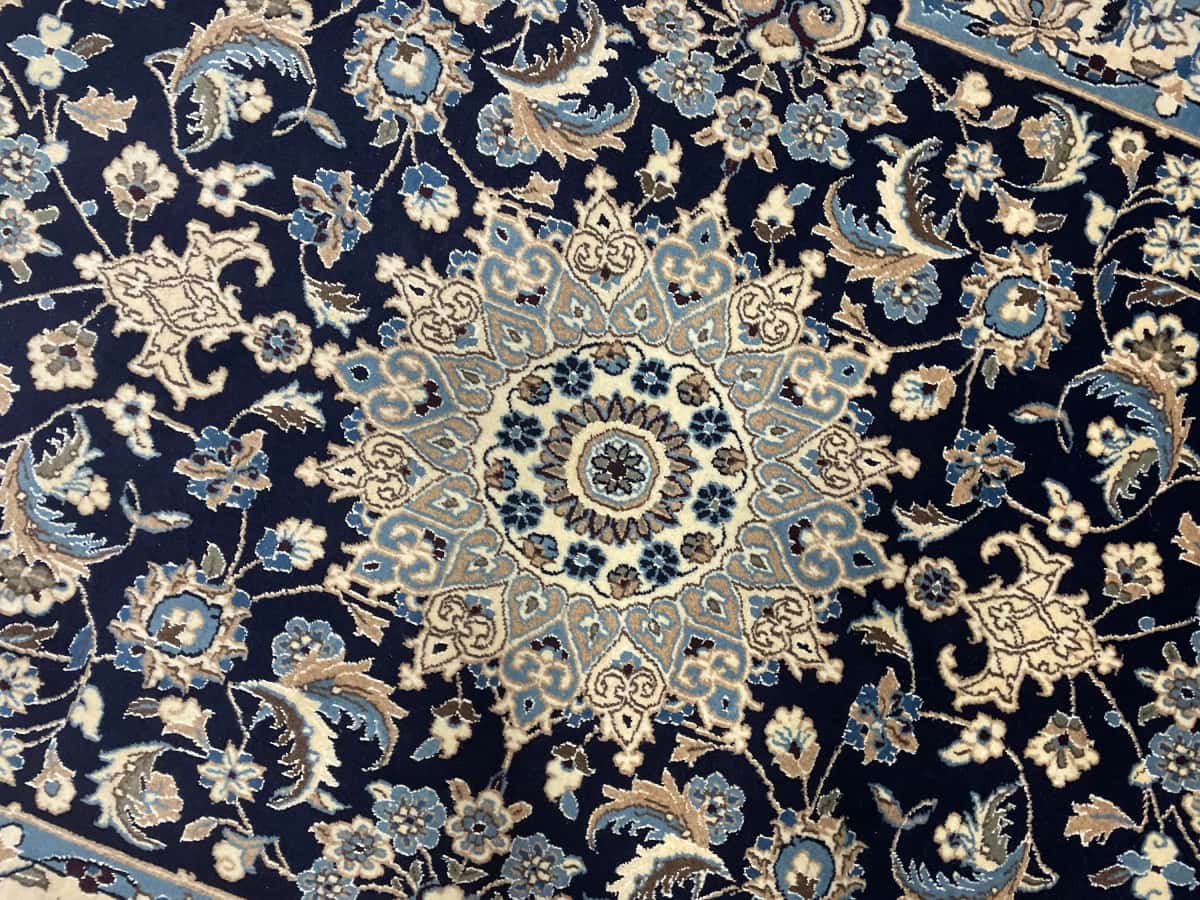 Persian rug of Nain style in dimensions 198 centimeters length by 142 centimeters width with mainly blue colors — Perspective