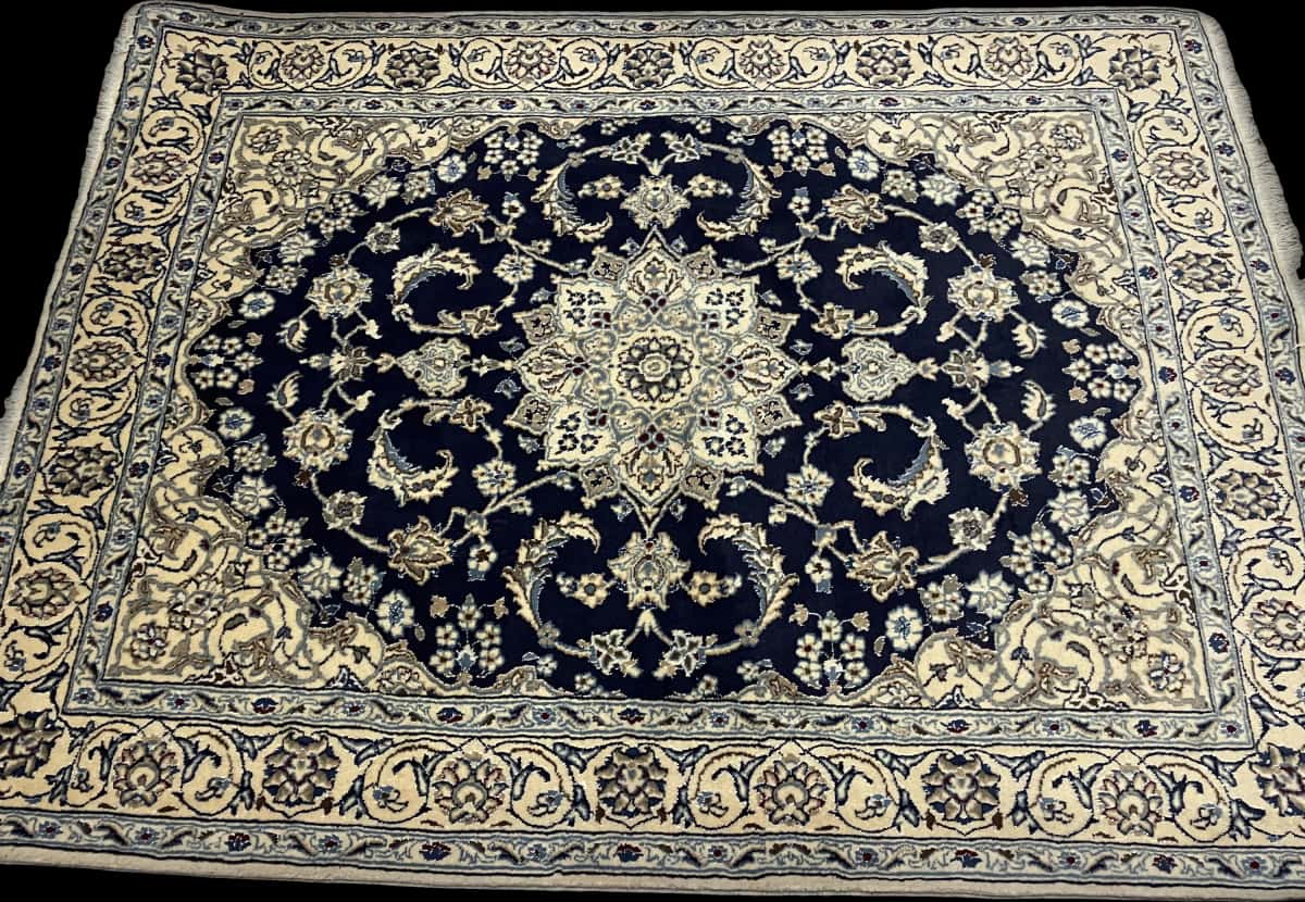 Persian rug of Nain style in dimensions 195 centimeters length by 146 centimeters width with mainly blue colors — Perspective
