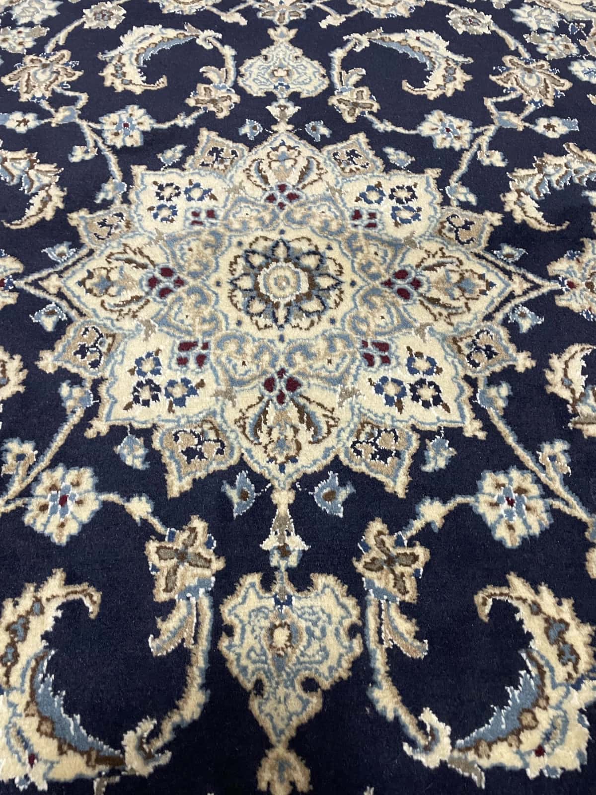 Persian rug of Nain style in dimensions 195 centimeters length by 146 centimeters width with mainly blue colors — Perspective