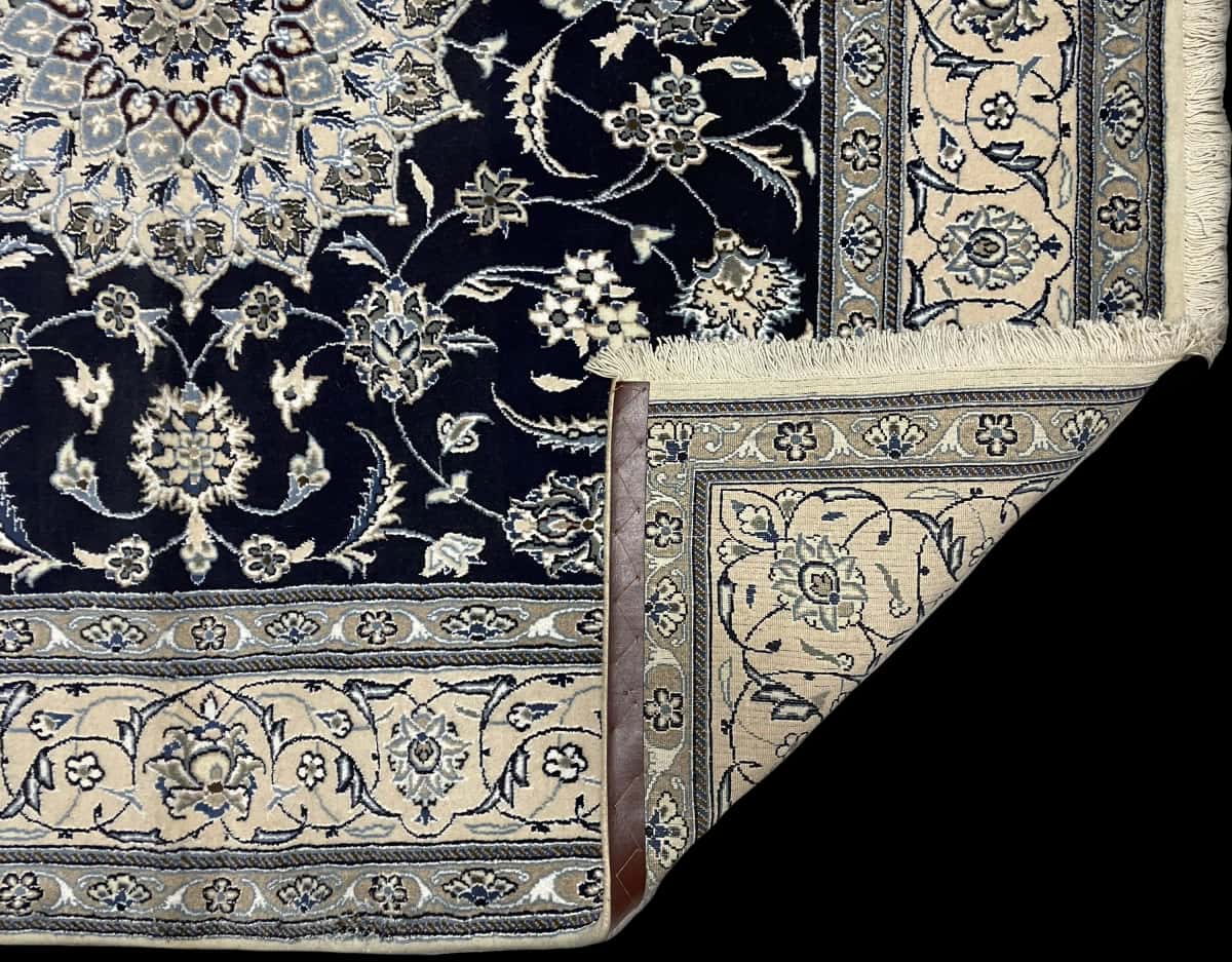 Persian rug of Nain style in dimensions 202 centimeters length by 198 centimeters width with mainly blue colors — Folded