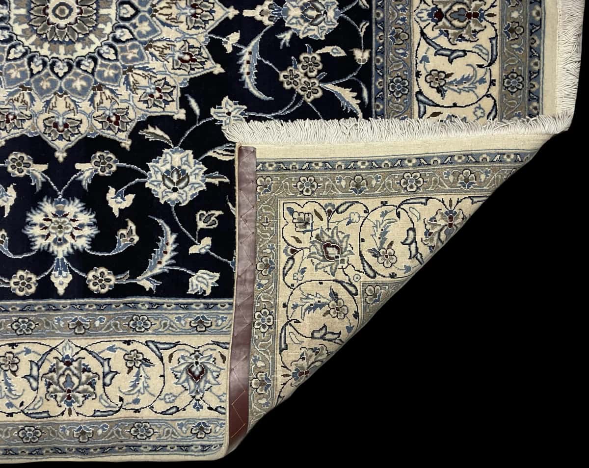 Persian rug of Nain style in dimensions 207 centimeters length by 200 centimeters width with mainly blue colors — Folded