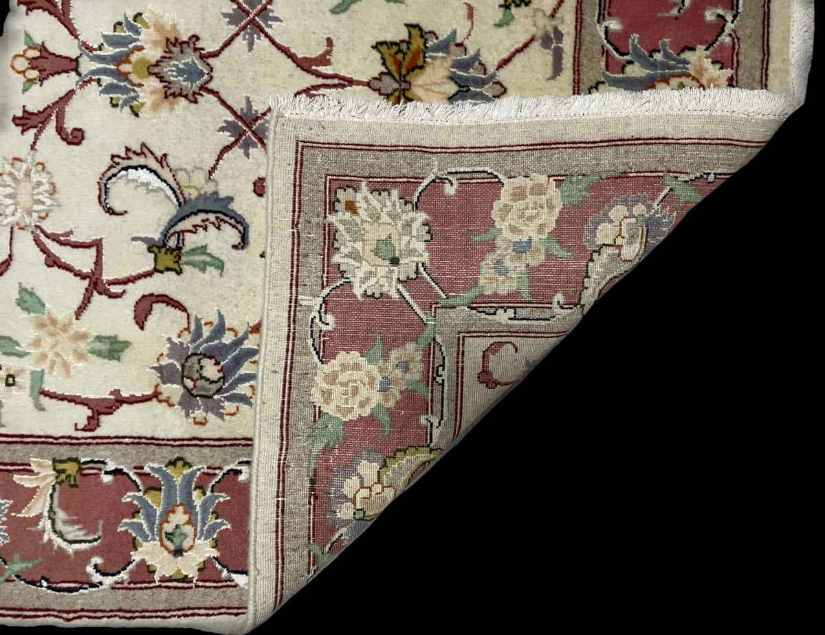 Persian rug in dimensions 195 centimeters length by 123 centimeters width with mainly beige colors — Folded