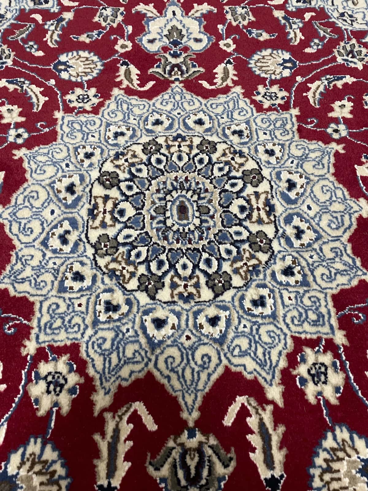 Persian rug of Nain style in dimensions 203 centimeters length by 140 centimeters width with mainly red and blue colors — Perspective