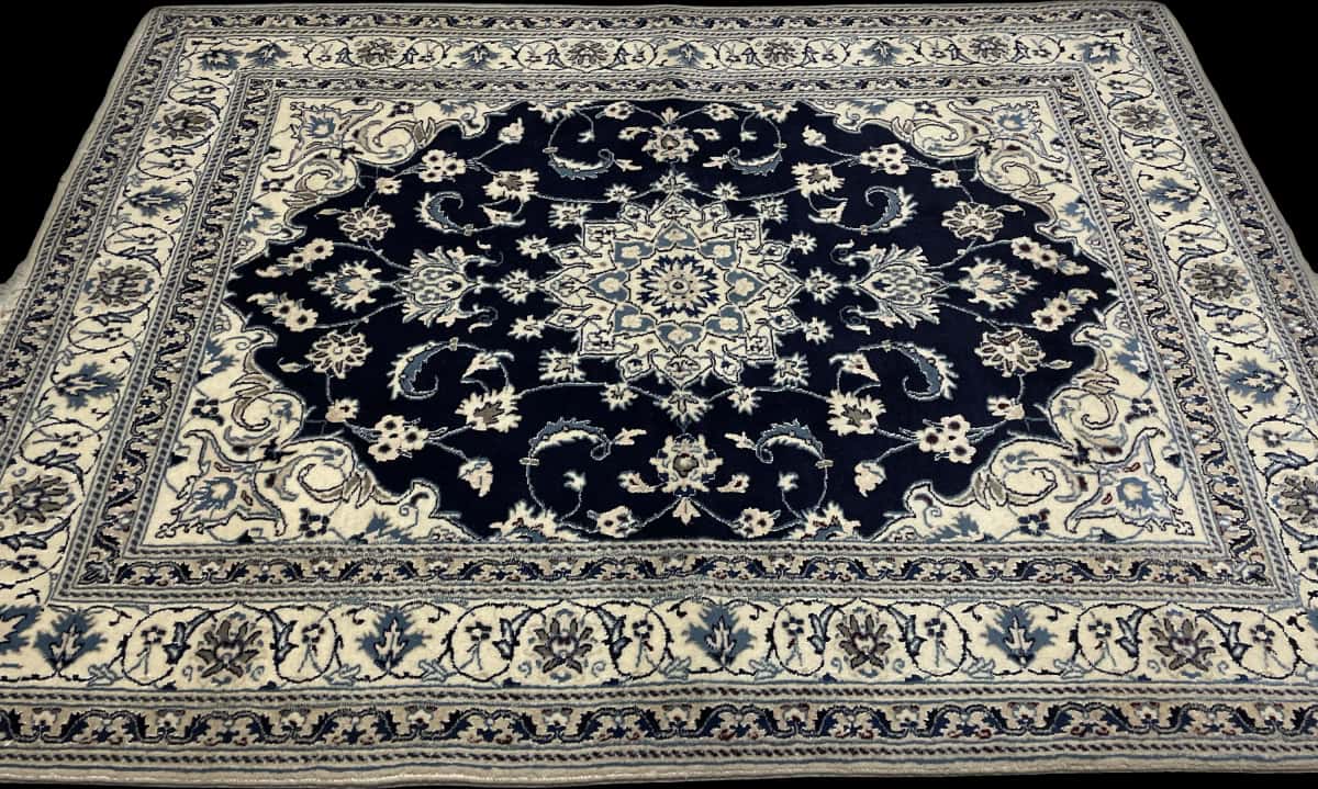 Persian rug of Nain style in dimensions 204 centimeters length by 148 centimeters width with mainly blue colors — Perspective
