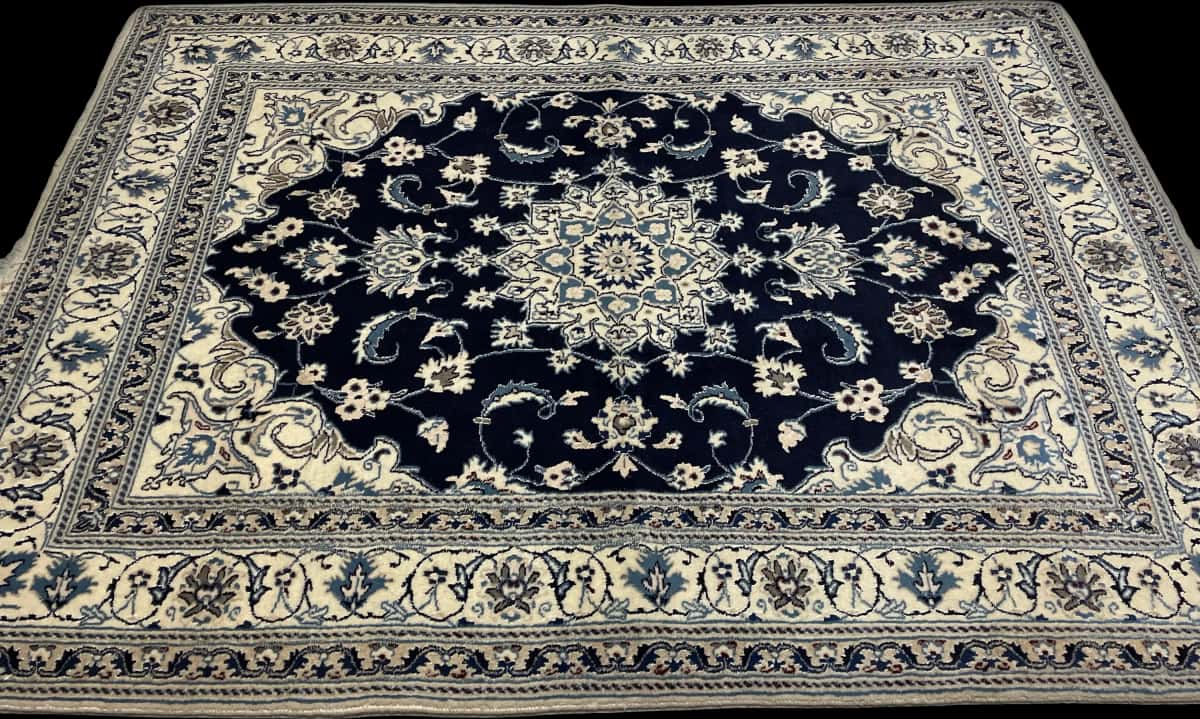 Persian rug of Nain style in dimensions 204 centimeters length by 148 centimeters width with mainly blue colors — Perspective