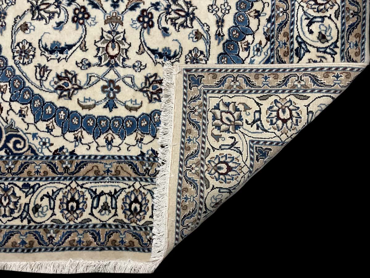 Persian rug of Nain style in dimensions 212 centimeters length by 148 centimeters width with mainly beige and blue colors — Folded