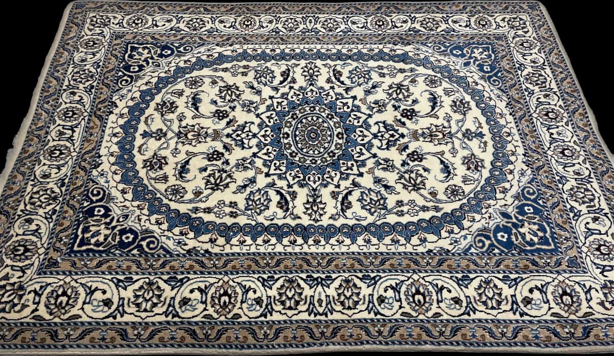 Persian rug of Nain style in dimensions 212 centimeters length by 148 centimeters width with mainly beige and blue colors — Perspective