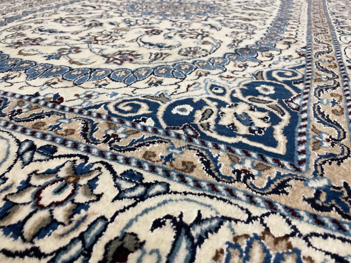 Persian rug of Nain style in dimensions 212 centimeters length by 148 centimeters width with mainly beige and blue colors — Perspective