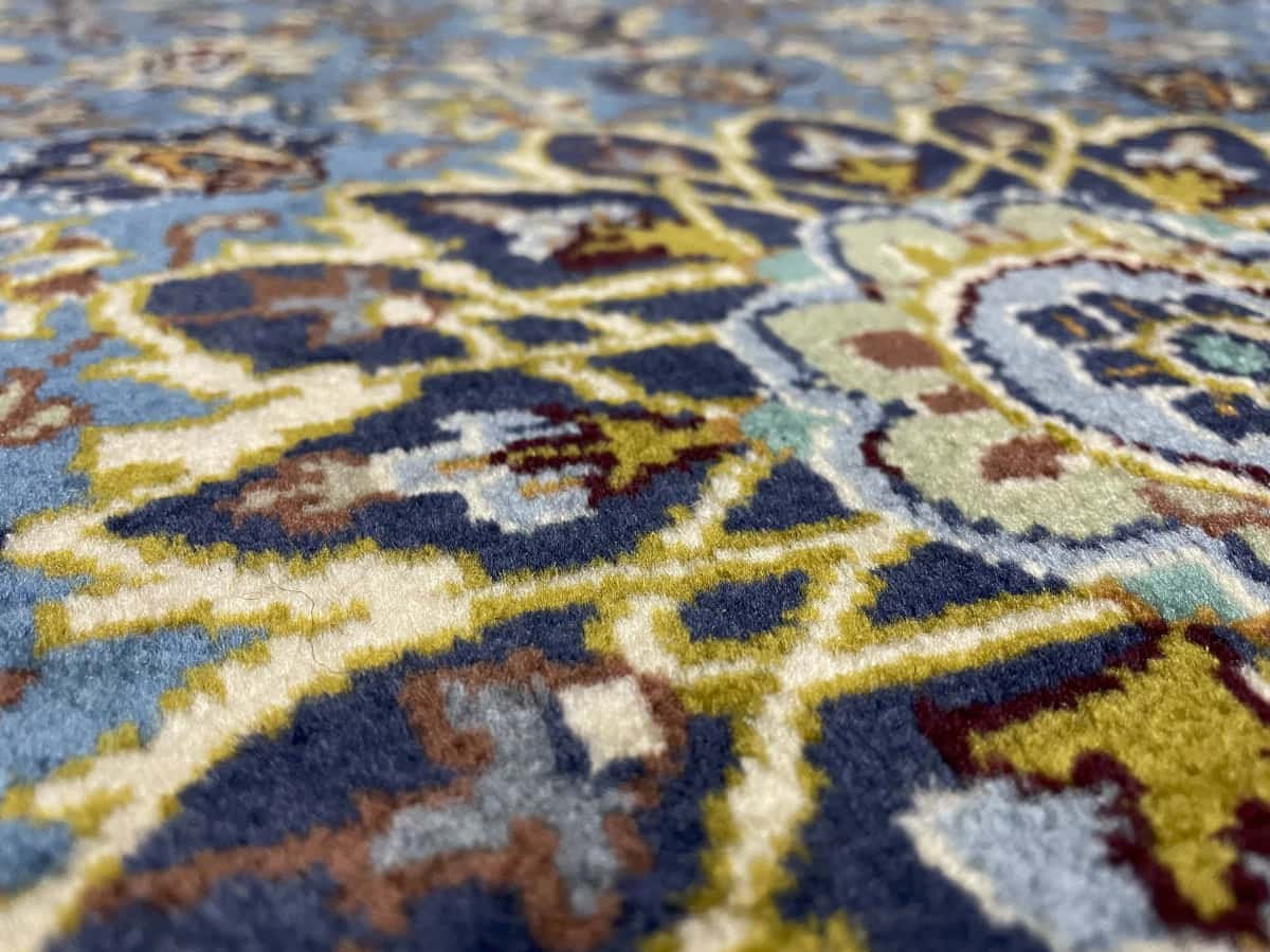 Persian rug of Kashmar style in dimensions 186 centimeters length by 126 centimeters width with mainly blue colors — Texture close-up