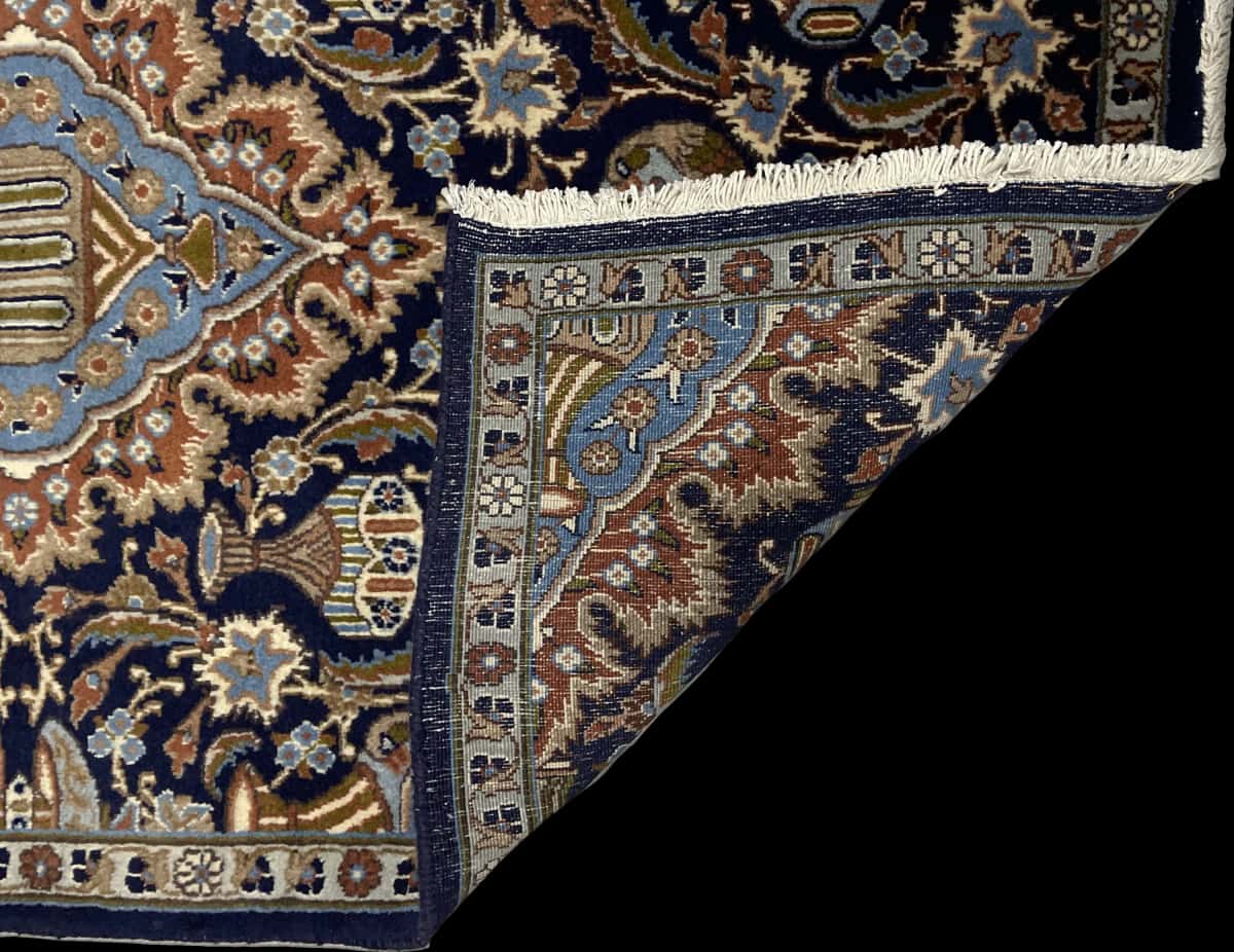 Persian rug of Kashmar style in dimensions 183 centimeters length by 107 centimeters width with mainly blue and black colors — Folded