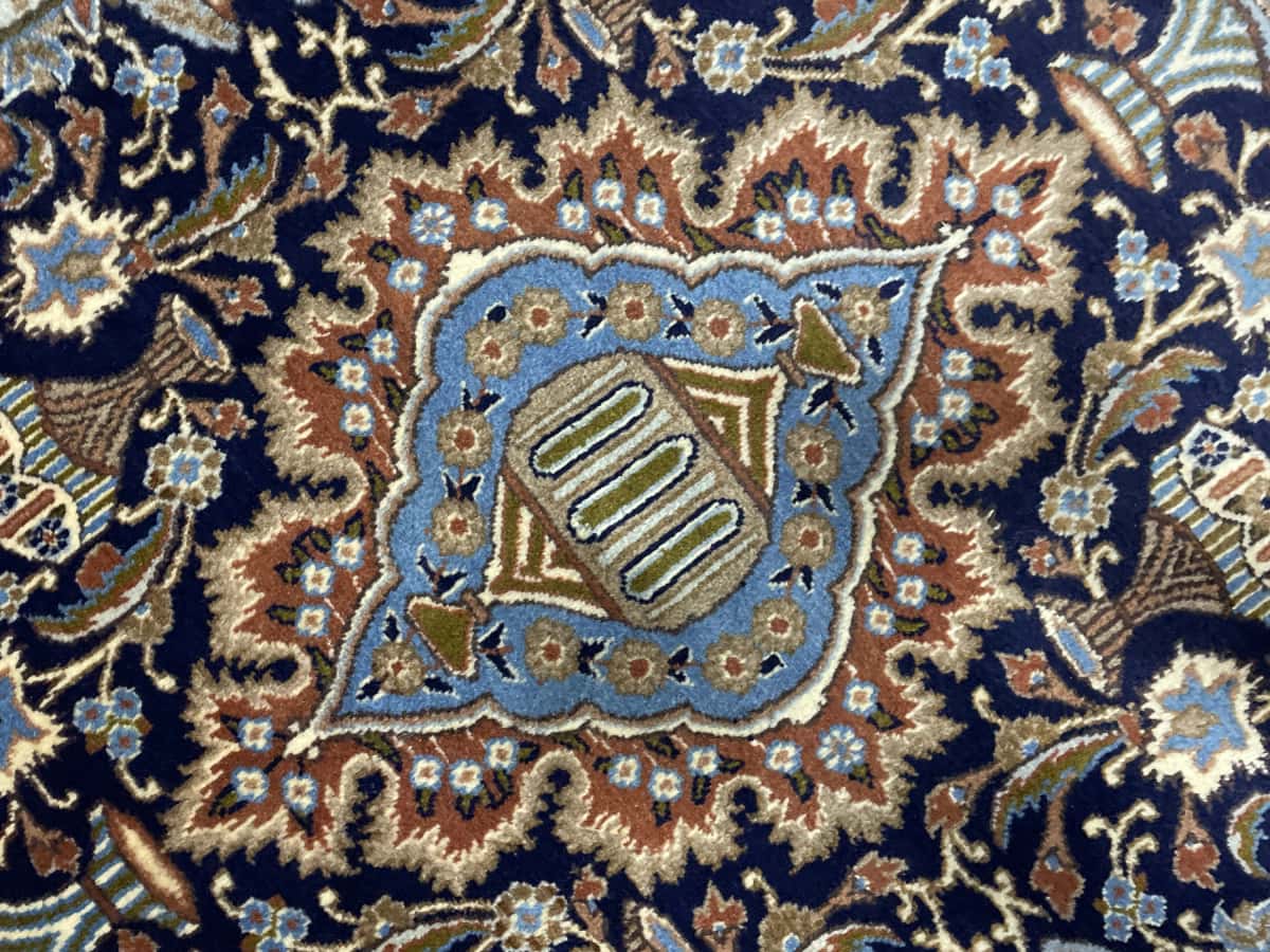 Persian rug of Kashmar style in dimensions 183 centimeters length by 107 centimeters width with mainly blue and black colors — Texture close-up