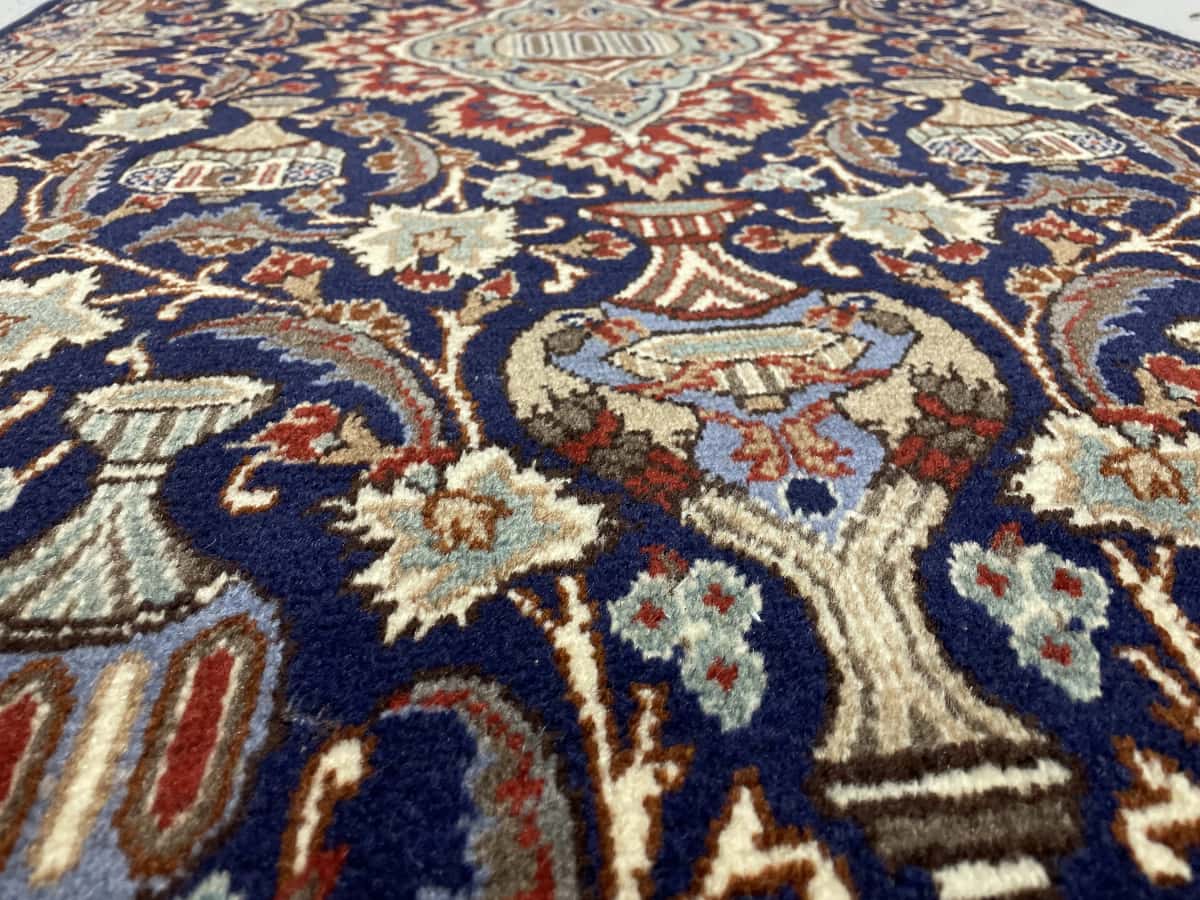 Persian rug of Kashmar style in dimensions 210 centimeters length by 106 centimeters width with mainly blue colors — Texture close-up