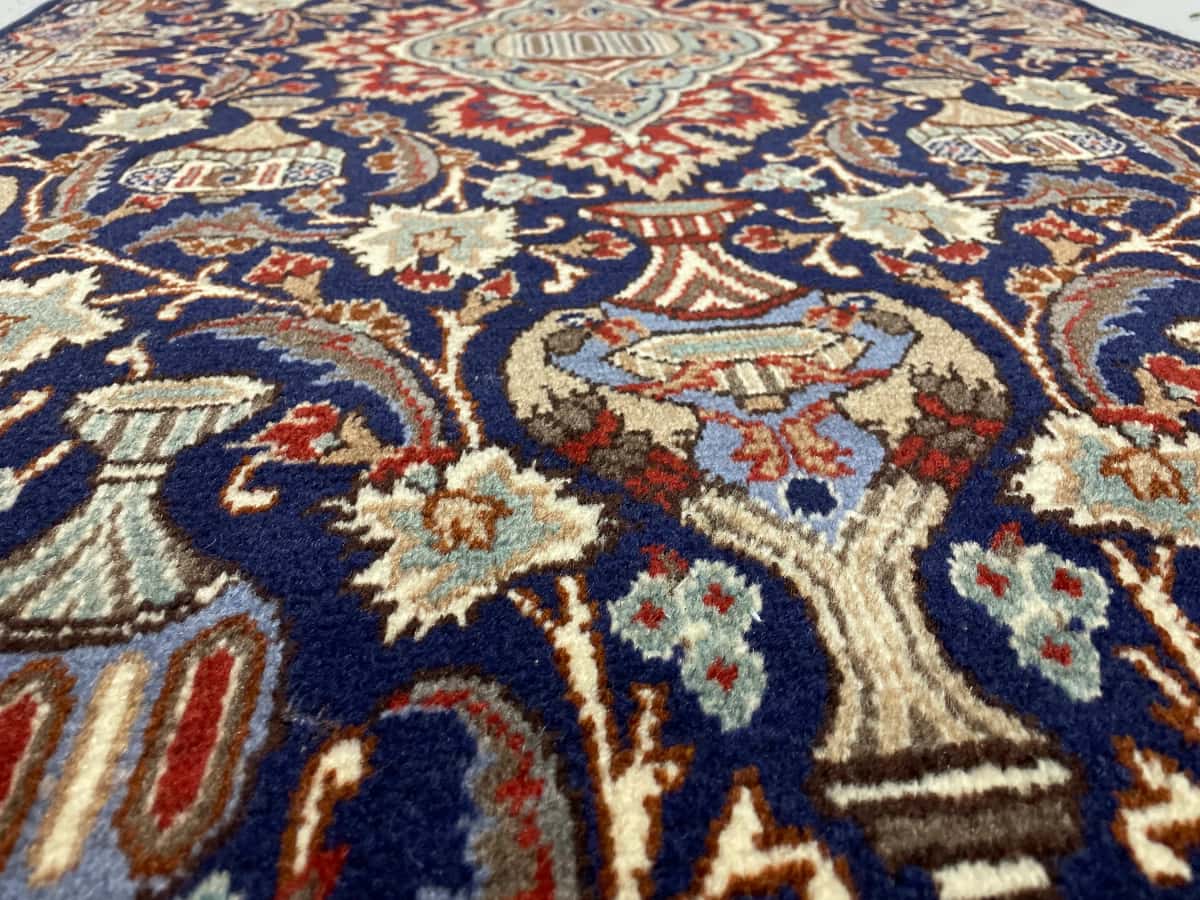 Persian rug of Kashmar style in dimensions 210 centimeters length by 106 centimeters width with mainly blue colors — Texture close-up