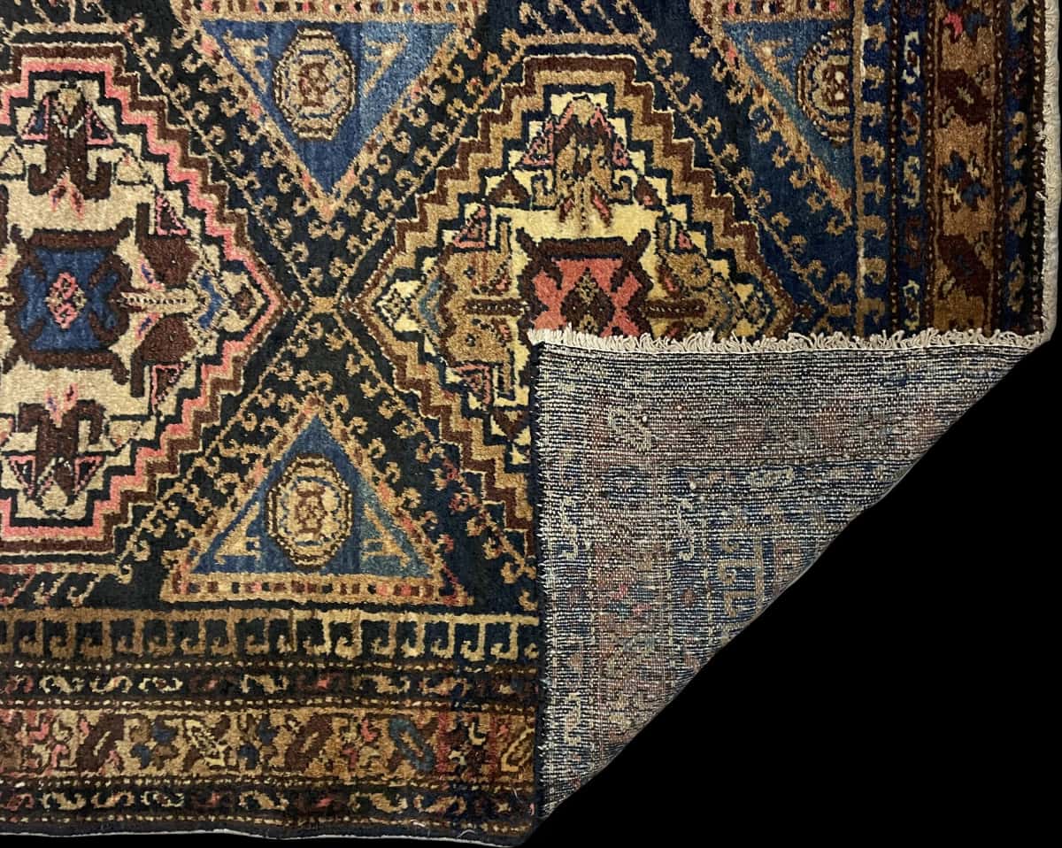 Persian rug of Hamadan style in dimensions 170 centimeters length by 97 centimeters width with mainly colorful colors — Folded