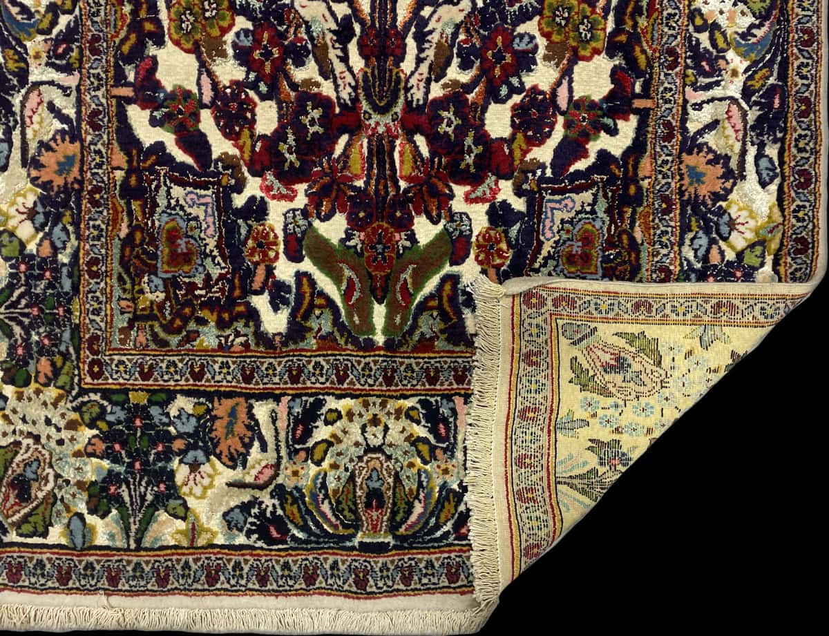 Persian rug of Kashmar style in dimensions 180 centimeters length by 103 centimeters width with mainly colorful colors — Folded